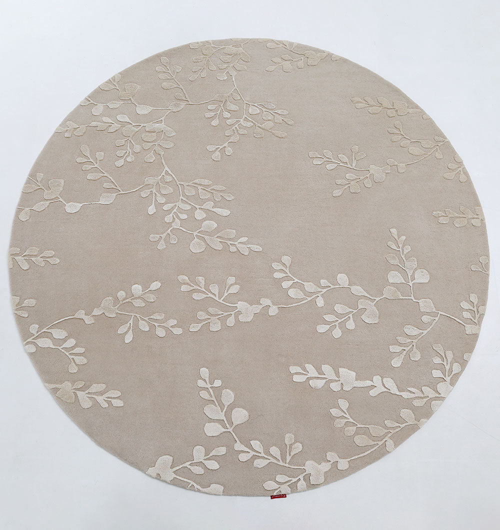 Decorative handmade area rug in beige color, featuring refined texture and expert-quality craftsmanship.