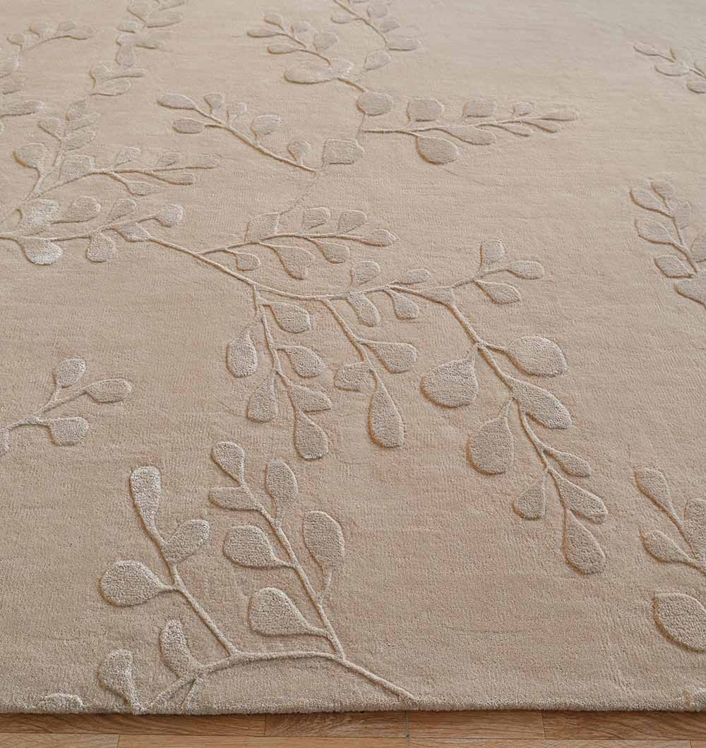 Close-up of the rectangular beige rug, highlighting the expert-quality craftsmanship and wool, viscose, cotton blend.