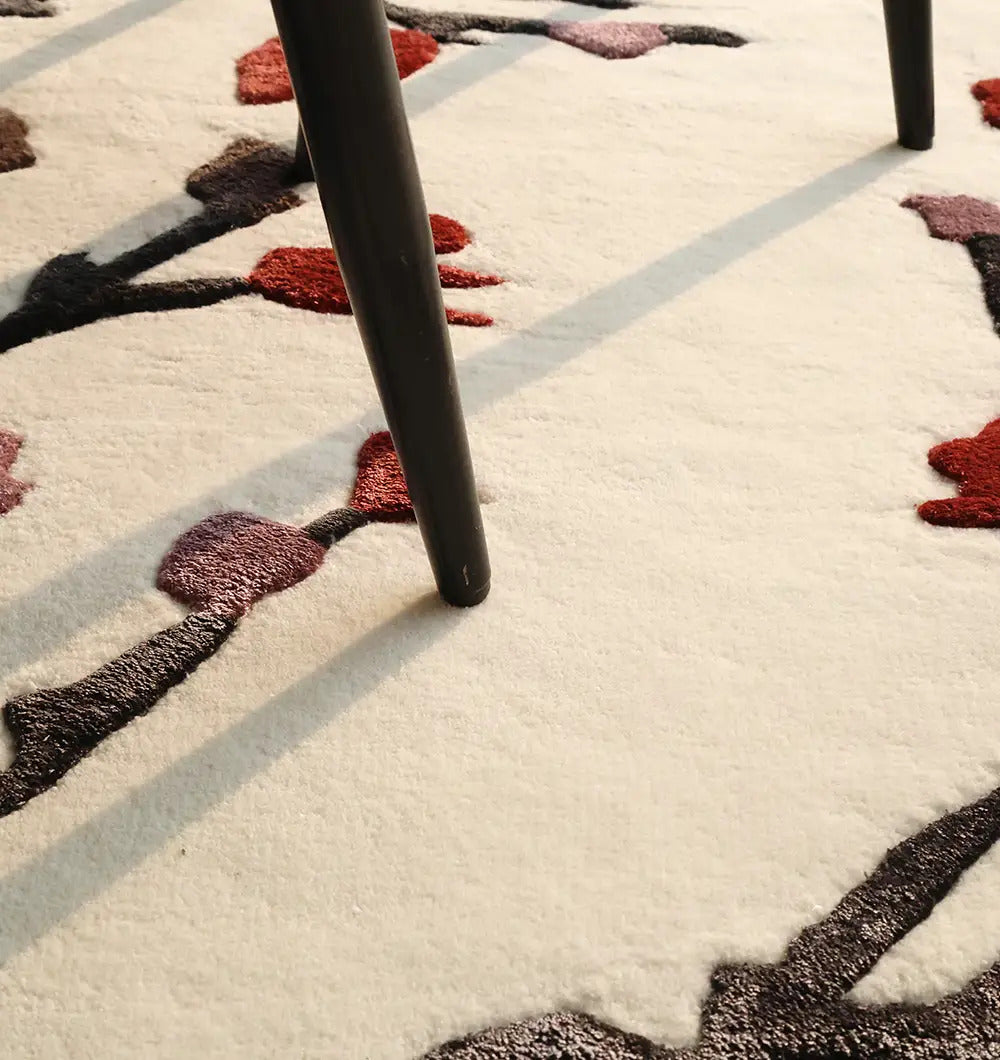 Close-up of the irregular rug's edge, highlighting the durable, handmade weave and soft touch finish.