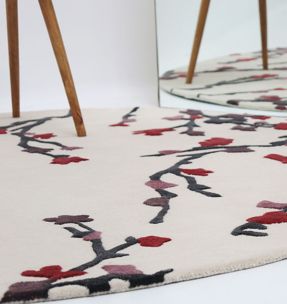 Detailed shot of the round rug's material composition, emphasizing the soft texture and vibrant color transitions.