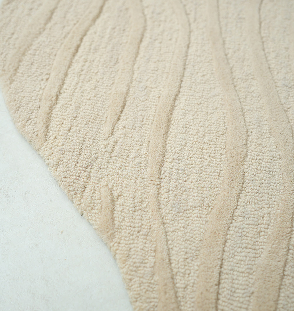 Close-up detailing the luxurious texture underfoot of the premium wool, viscose, and cotton fiber blend, crafted with meticulous attention.