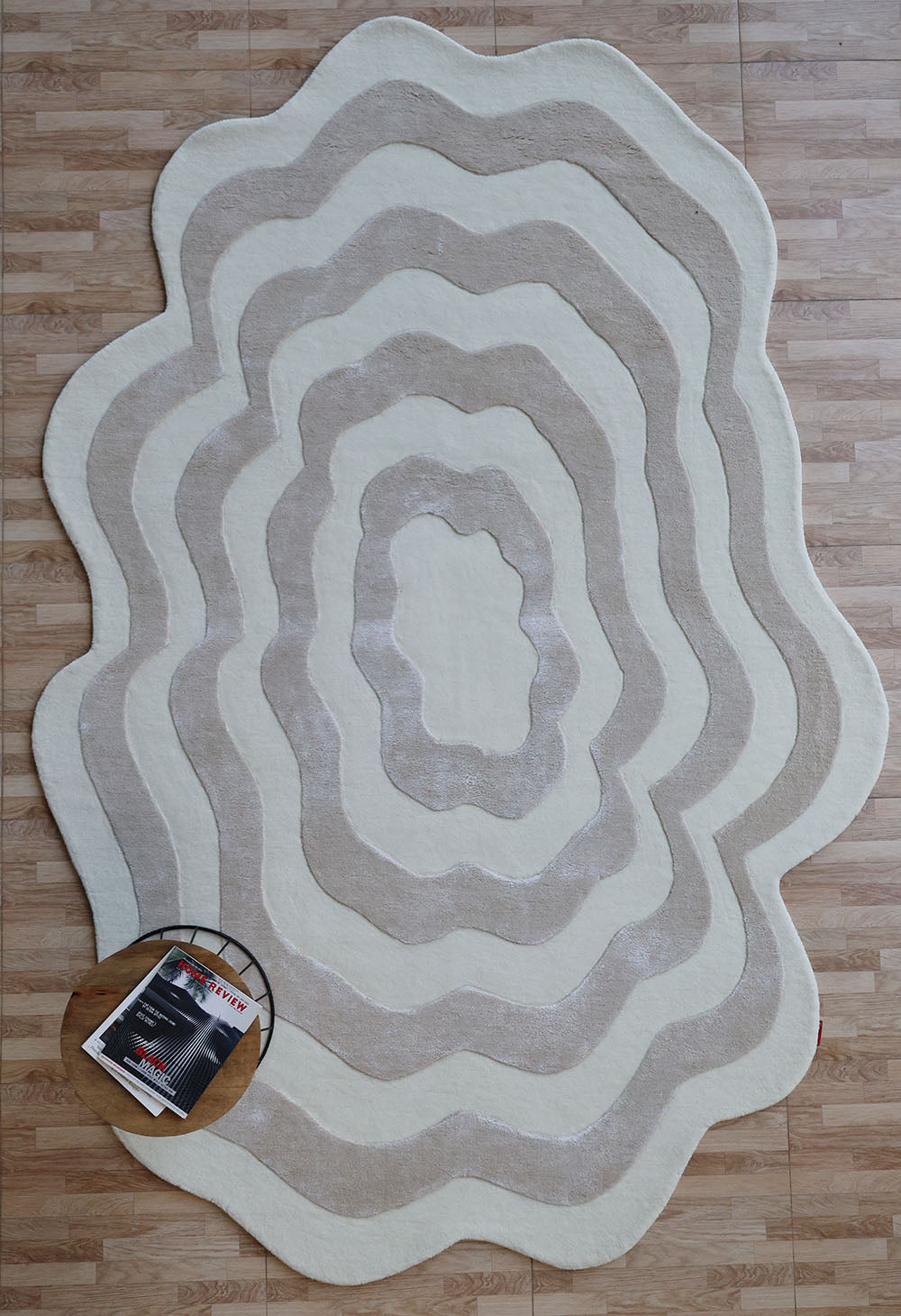 Beige and cream wavy handmade area rug in an irregular shape, showcasing superior quality and aesthetic sophistication.