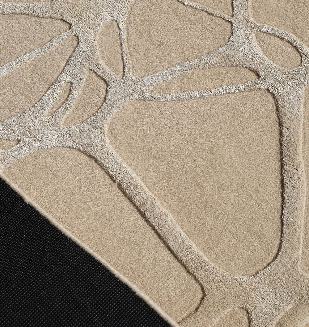 Close-up of the RAMSHA HOME Natural White Color Handmade Area Rug (HTWV-145, 200x300 cm) shows its raised abstract pattern and black textured backing, emphasizing this modern area rug’s distinctive handmade design.