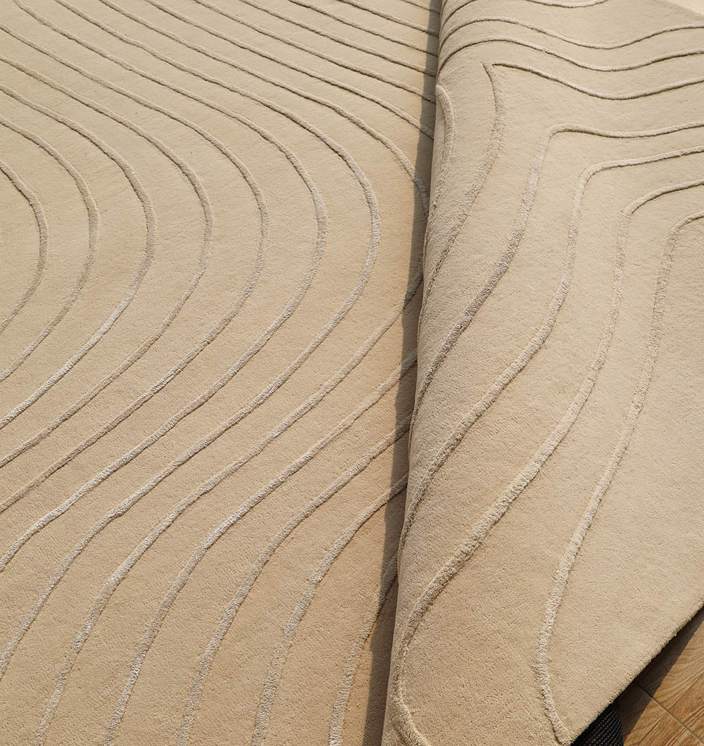 The RAMSHA HOME Beige Color Handmade Decorative Area Rug - HTWV 161 (300X400 cm) features raised wavy lines and a hand-tufted design, adding depth, texture, and modern style to your space with its neutral tones.