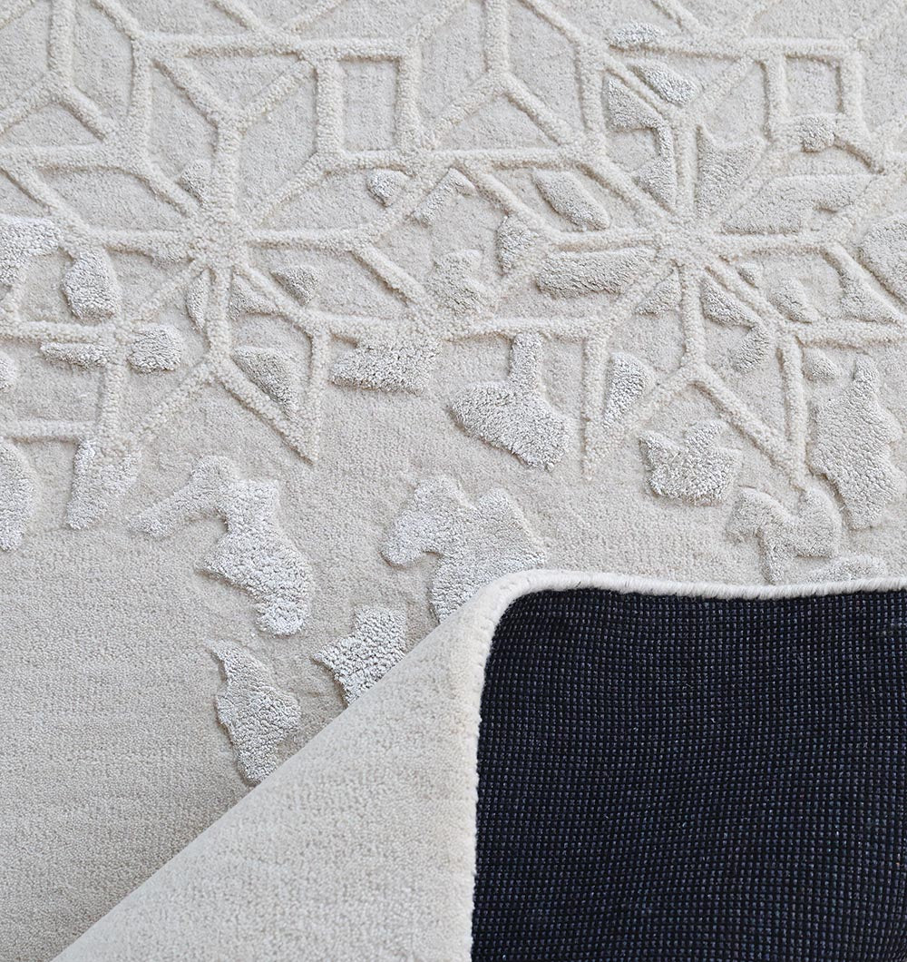 Close-up of RAMSHA HOME's Handmade Beige Color Area Rug - HTWV 165 (200x300 cm), highlighting its textured, hand-tufted wool design and a flipped corner that reveals the black non-slip backing.