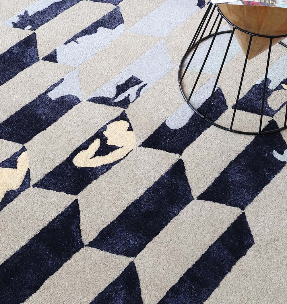 The RAMSHA HOME Multi Color Handmade Decorative Area Rug - HTWV 166 (300x400 cm) features blue, grey, beige, and dark blue abstract shapes, adding modern style and complementing round metal tables in any space.