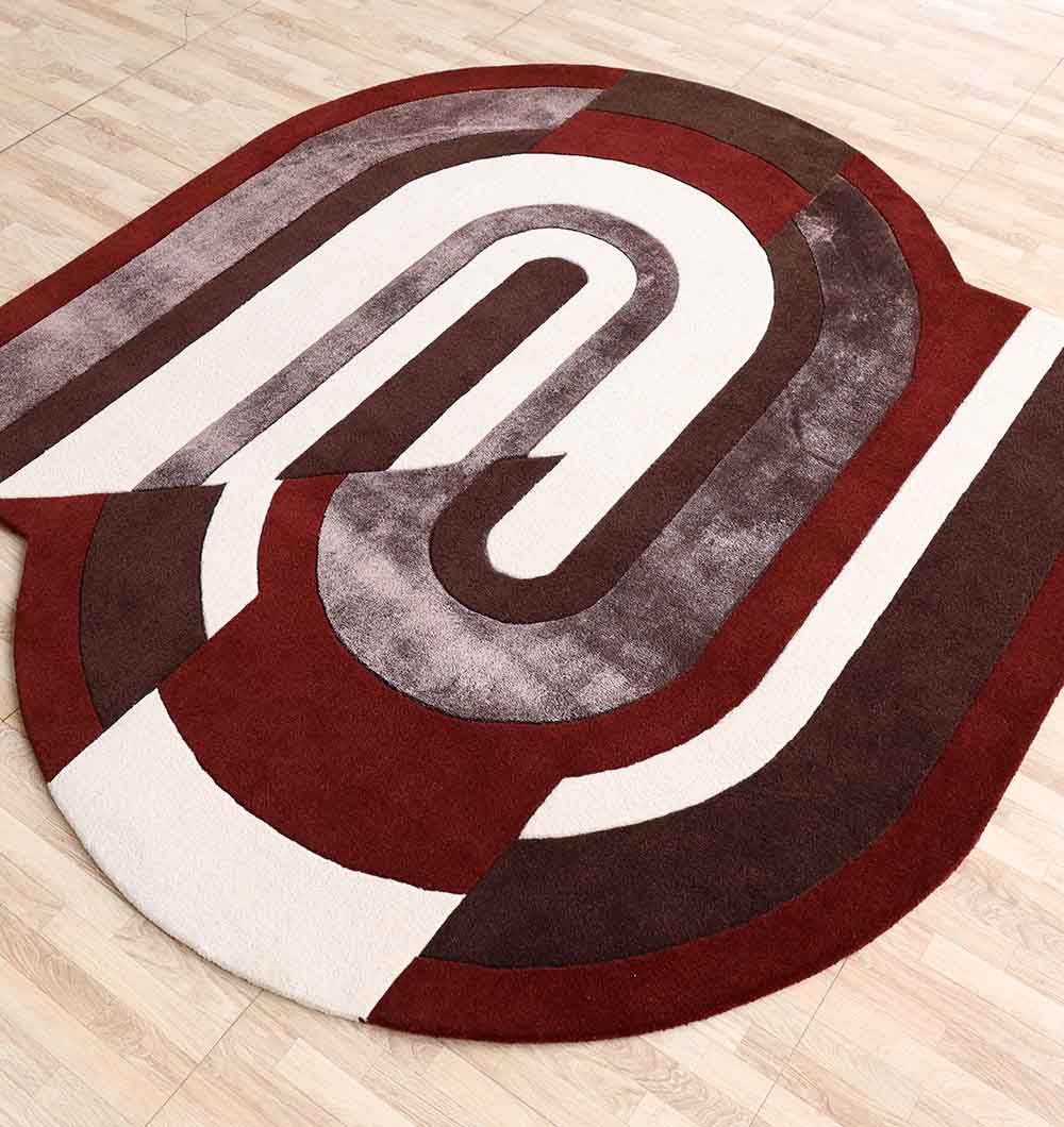 The RAMSHA HOME Modern Geometric Shaped Rug HTWV 184 (200 x 226 cm) features a bold geometric pattern with intersecting arcs and curved, overlapping designs in white, brown, and maroon, complementing a light wood floor.