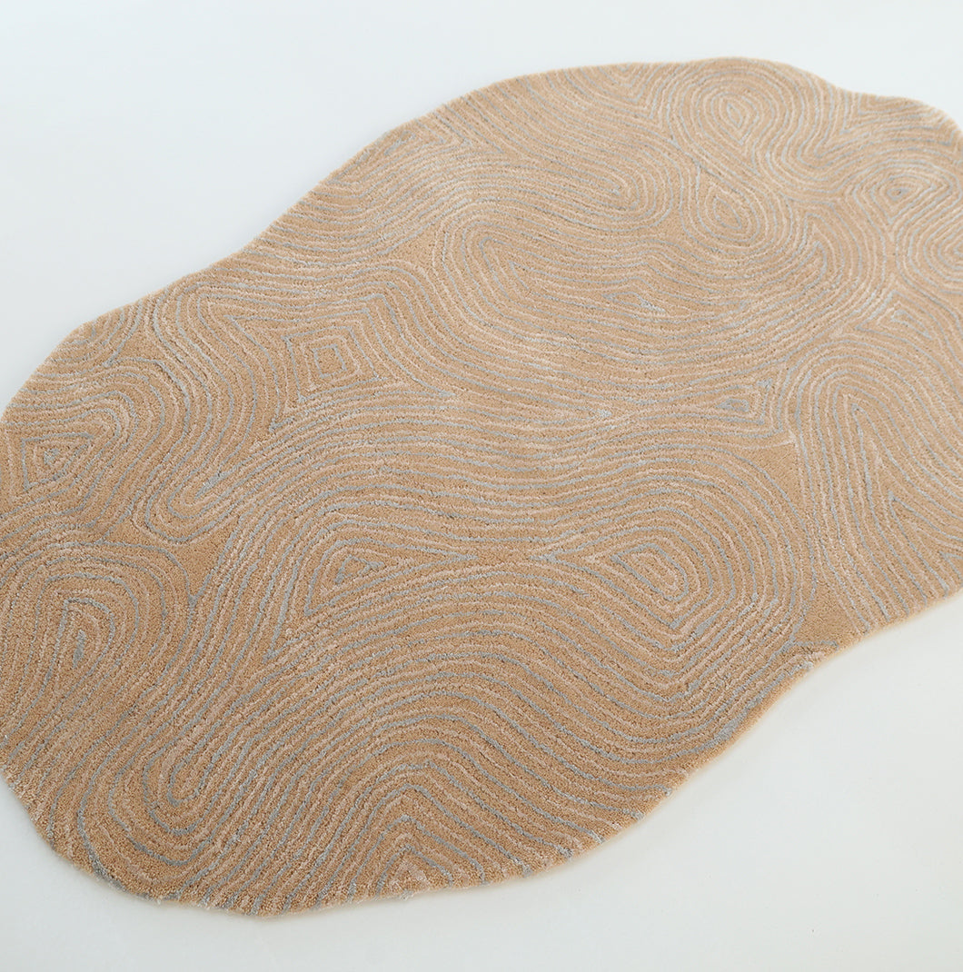 The RAMSHA HOME Handmade Beige Abstract Shaped Rug 200 cm HTWV-188 features an organic, irregular silhouette and elegant swirling white patterns reminiscent of raked sand or fingerprints. Hand-tufted and displayed on a white background, this rug’s abstract design adds artistry and sophistication to any space.