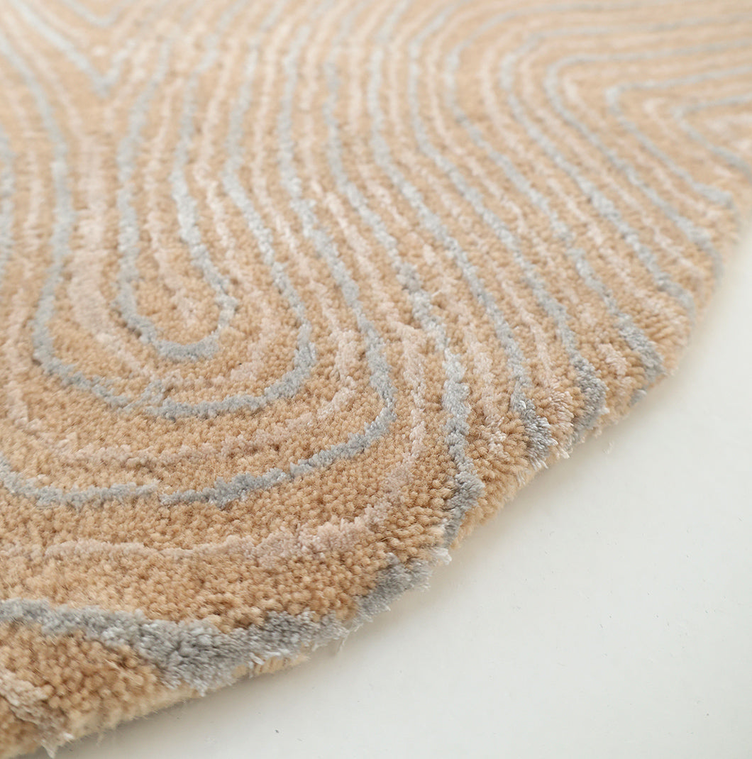 Close-up of the RAMSHA HOME Handmade Beige Abstract Shaped Rug 200 cm HTWV-188, featuring a textured hand-tufted surface with raised wavy lines and an abstract design, shown on a white background.