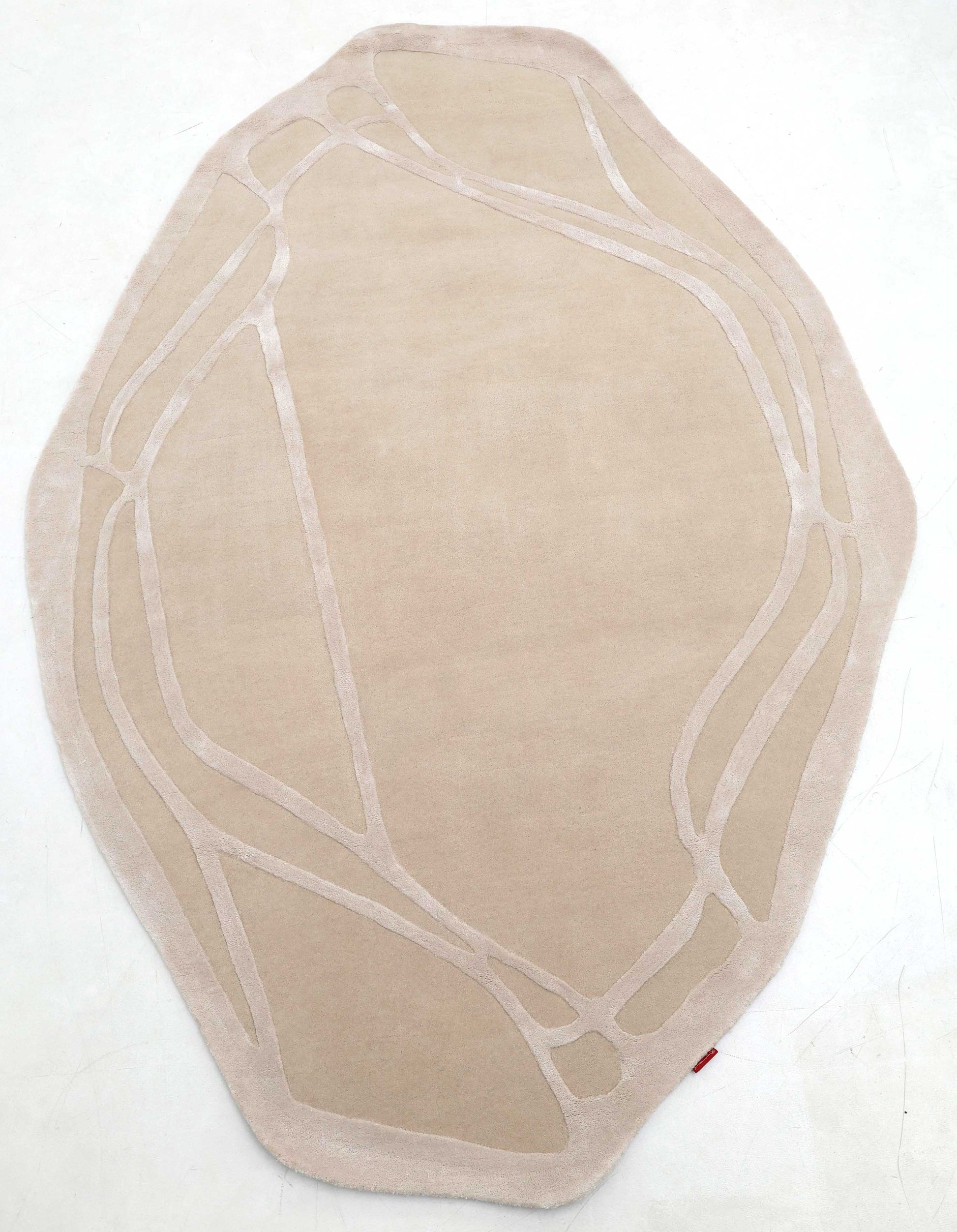 The RAMSHA HOME Handmade irregular 200x300 cm Rug HTWV-190 features cream and beige tones with lighter abstract lines resembling organic paths, shown on a plain white surface.