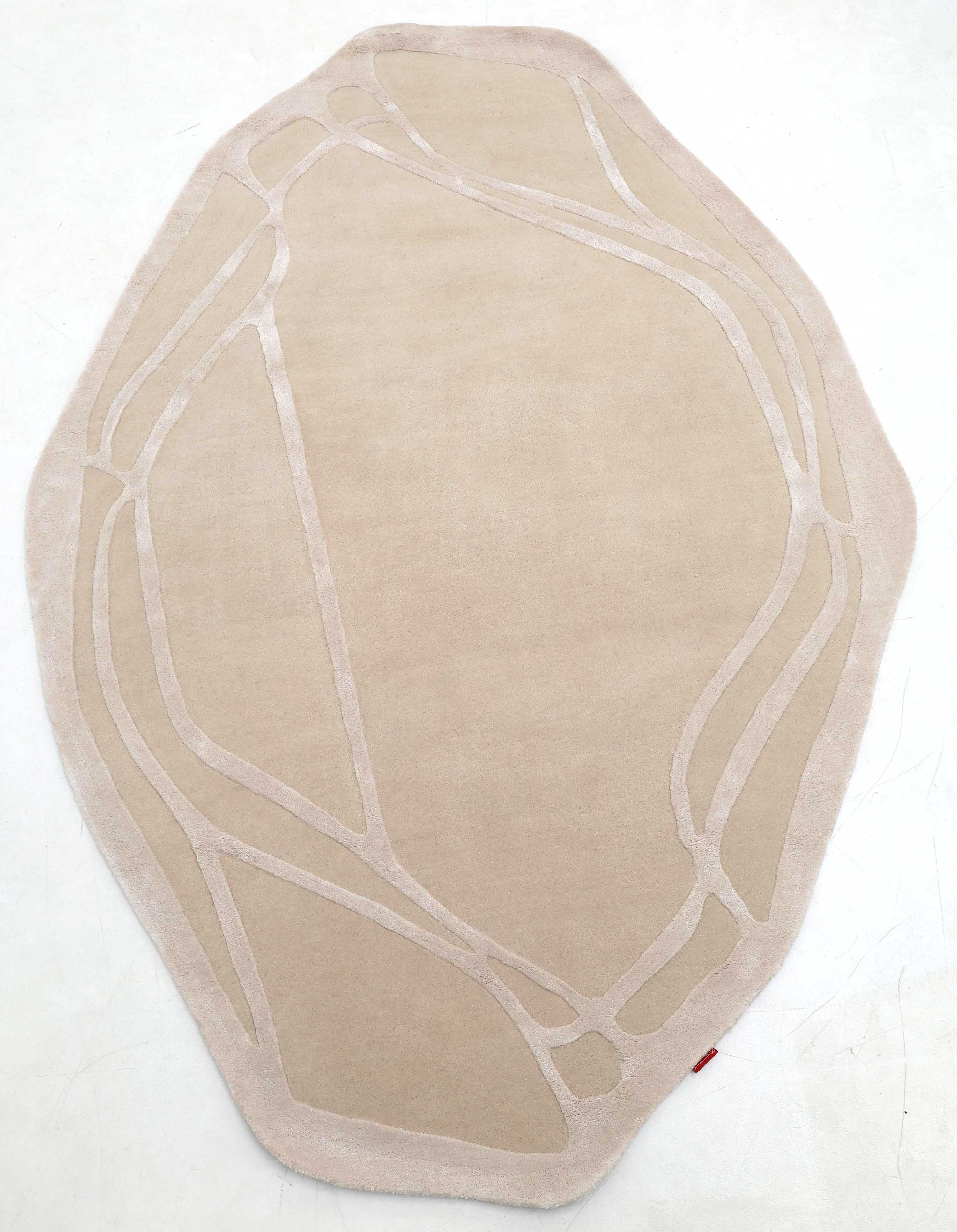The RAMSHA HOME Handmade irregular 200x300 cm Rug HTWV-190 features cream and beige tones with lighter abstract lines resembling organic paths, shown on a plain white surface.