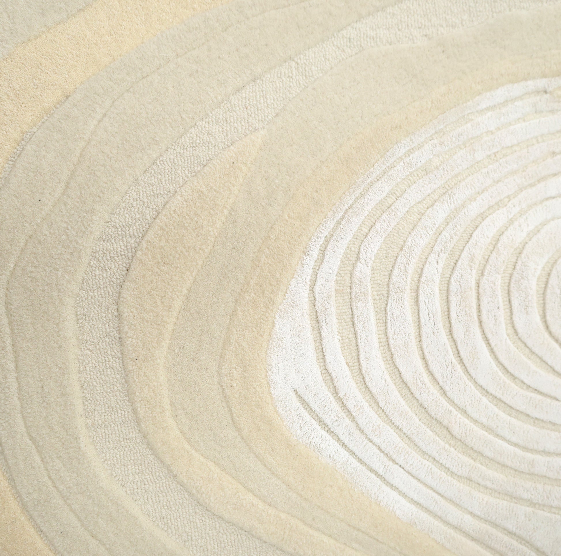 Featuring layered, textured patterns in light beige and off-white, the RAMSHA HOME Ivory Topographic Shaped Rug 200x300 cm (HTWV-192) showcases natural gradients and modern topographic lines reminiscent of tree growth rings.