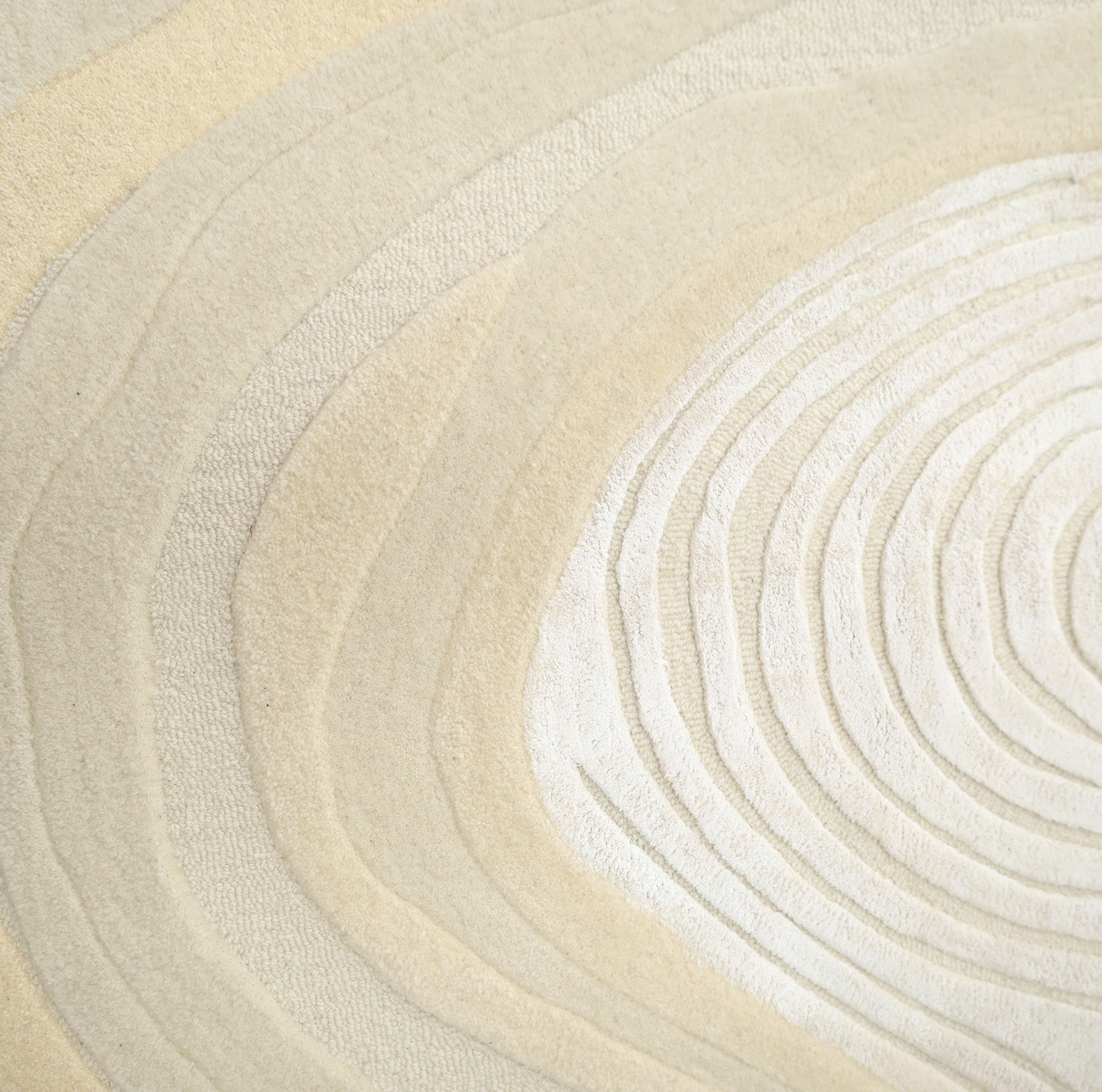 Featuring layered, textured patterns in light beige and off-white, the RAMSHA HOME Ivory Topographic Shaped Rug 200x300 cm (HTWV-192) showcases natural gradients and modern topographic lines reminiscent of tree growth rings.