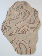 The RAMSHA HOME Desginer Freeform Handmade Rug HTWV-196 features swirling beige, brown, and light blue patterns, echoing natural stone or wood textures—an eye-catching modern piece for your interior.