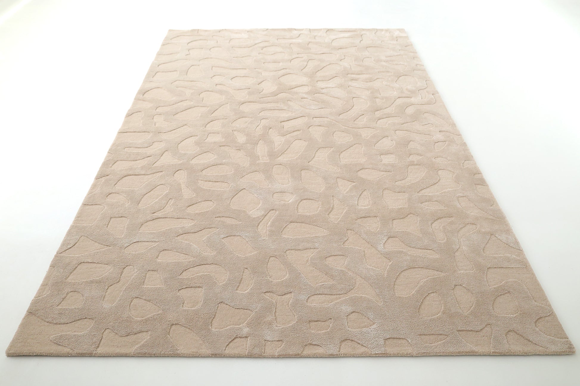 The RAMSHA HOME Rectangle Modern Handmade Rug 200x300 CM HTWV-197 is a beige, hand-woven rug with a raised abstract pattern of curved and irregular shapes, shown on a white background for a textured, modern look.