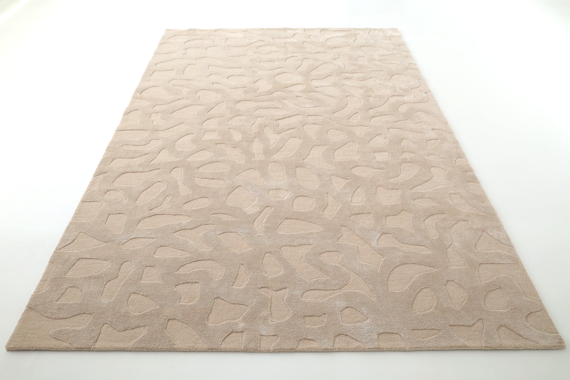 The RAMSHA HOME Rectangle Modern Handmade Rug 200x300 CM HTWV-197 is a beige, hand-woven rug with a raised abstract pattern of curved and irregular shapes, shown on a white background for a textured, modern look.
