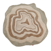 The RAMSHA HOME Designer Freeform Handmade Rug HTWV-200 features layered wavy beige and brown patterns, evoking topographic lines or tree rings—an abstract statement piece ideal for modern interiors.