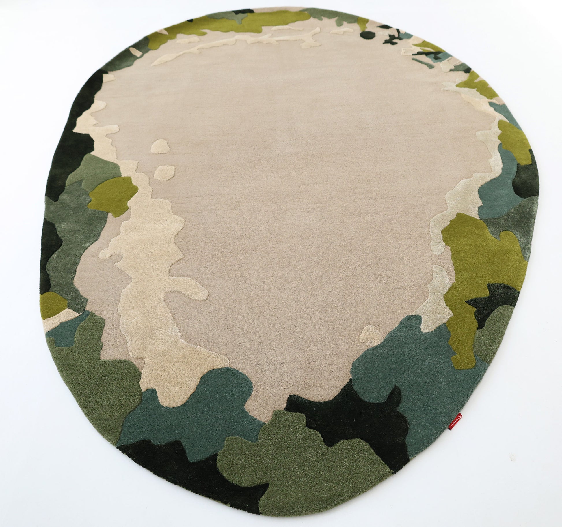The RAMSHA HOME Terra Eclipse Oval Handmade Rug HTWV-201 features an abstract, camouflage-inspired pattern in beige, green, dark green, and black—perfect for adding a modern accent to your space. Pictured on a white background.