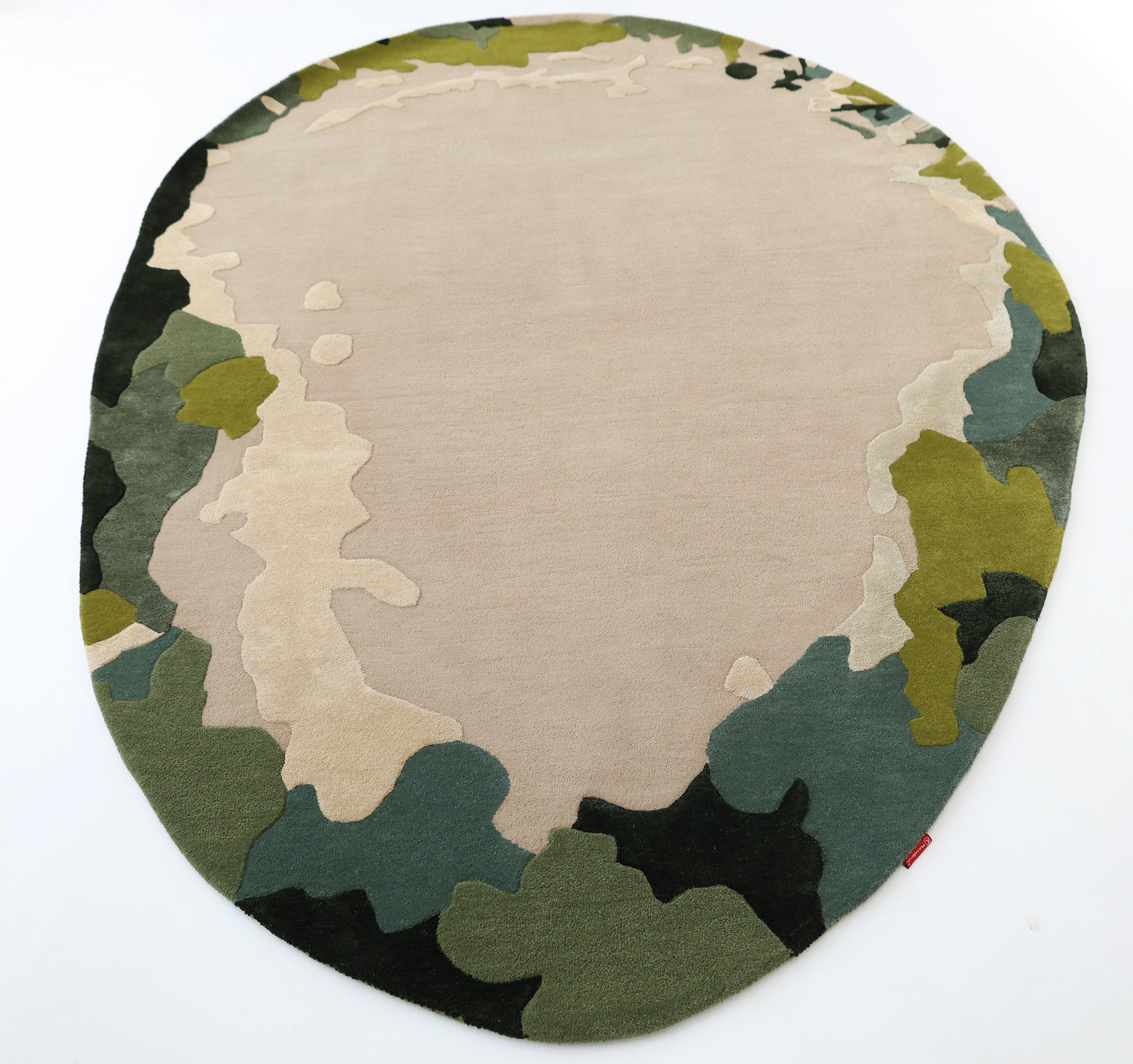 The RAMSHA HOME Terra Eclipse Oval Handmade Rug HTWV-201 features an abstract, camouflage-inspired pattern in beige, green, dark green, and black—perfect for adding a modern accent to your space. Pictured on a white background.