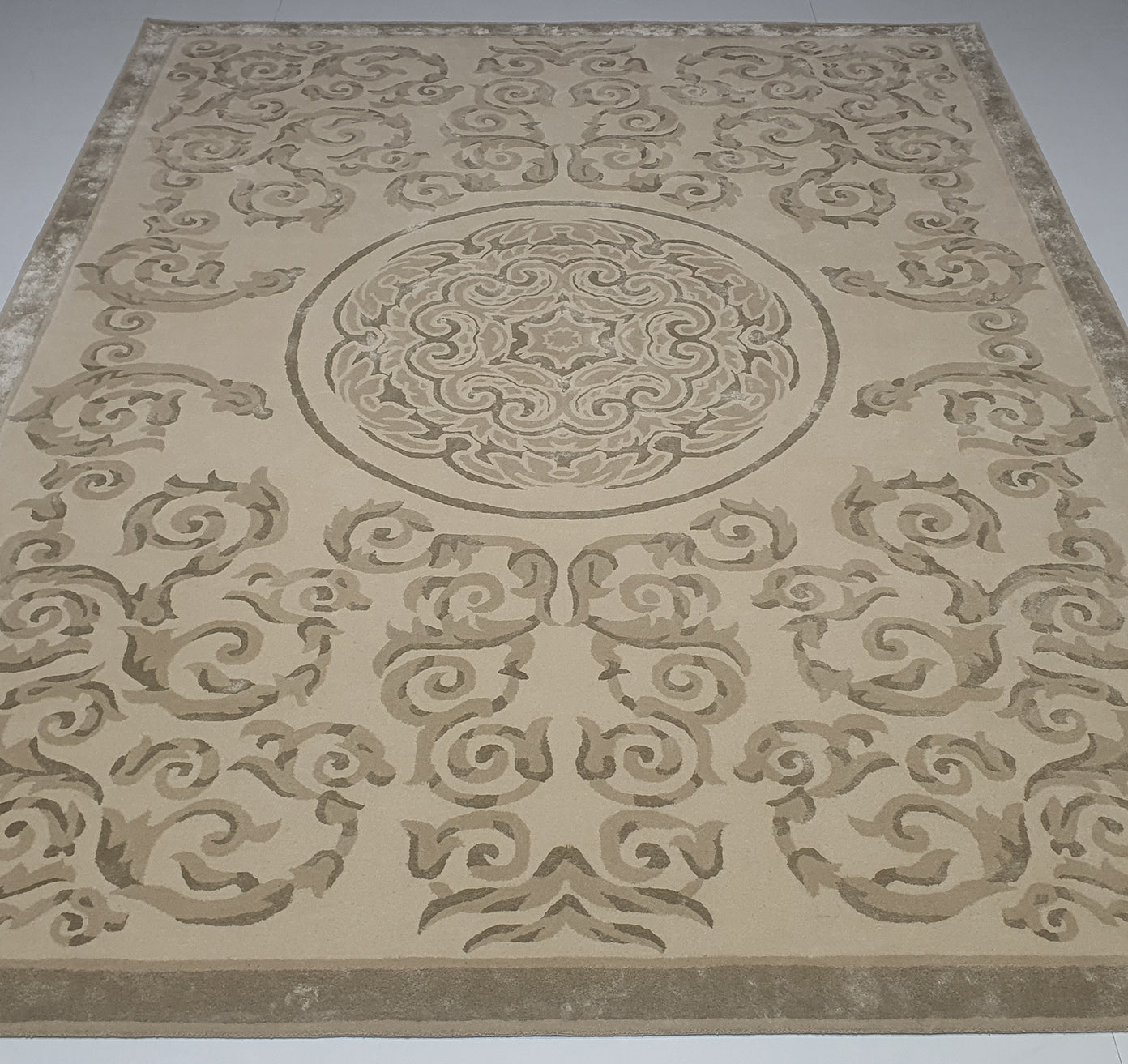 The RAMSHA HOME Amazing Multi Color Modern Floor Rug - HTWV 57 (300x400cm) features a rectangular beige handtufted wool design with tan and brown swirls, floral motifs, a central medallion, and a detailed patterned border.
