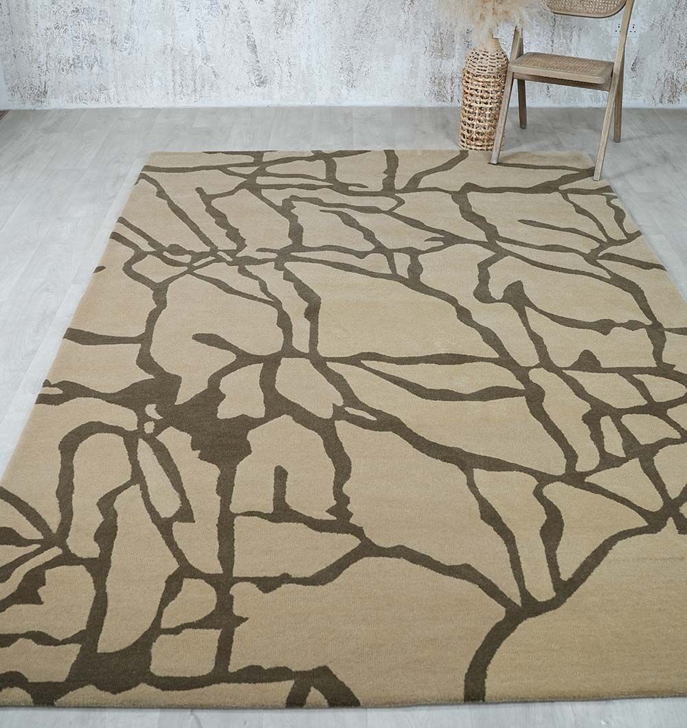 The Stunning Multi Color Fluffy Wool Handmade Rug - HTW 21 (202x292cm) by RAMSHA HOME is displayed on a light wood floor, near a woven basket and a chair, against a textured white and gray wall.