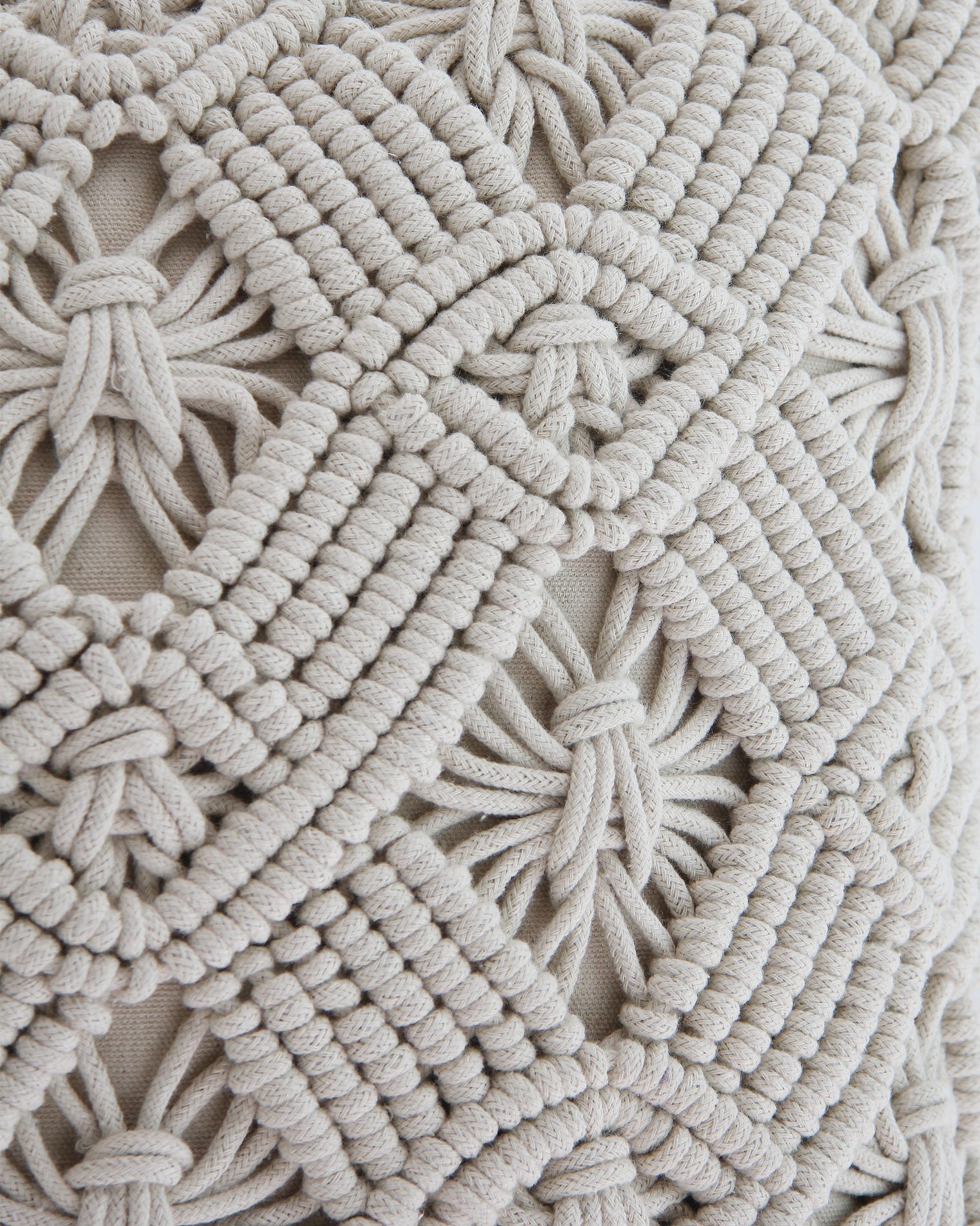 Close-up of the RAMSHA HOME Macrame Cotton Cushion CS-164 in off-white, featuring detailed diamond and star knotted patterns that highlight its luxurious texture and expert craftsmanship.