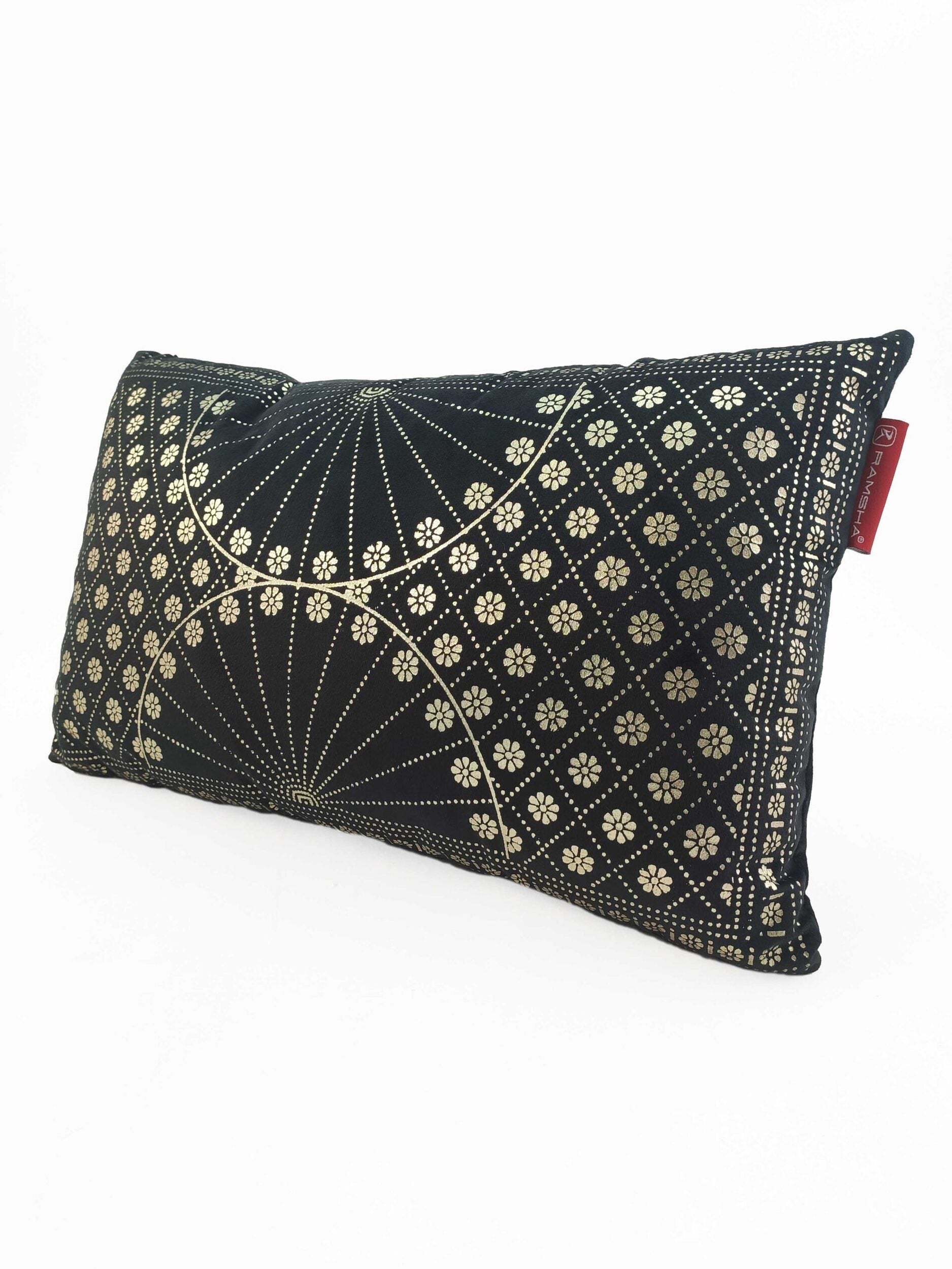 The RAMSHA HOME Home Decor Polyester Cushion features a black rectangular design with an intricate gold geometric and floral pattern, including intersecting lines and small flower motifs, set against a plain white background.