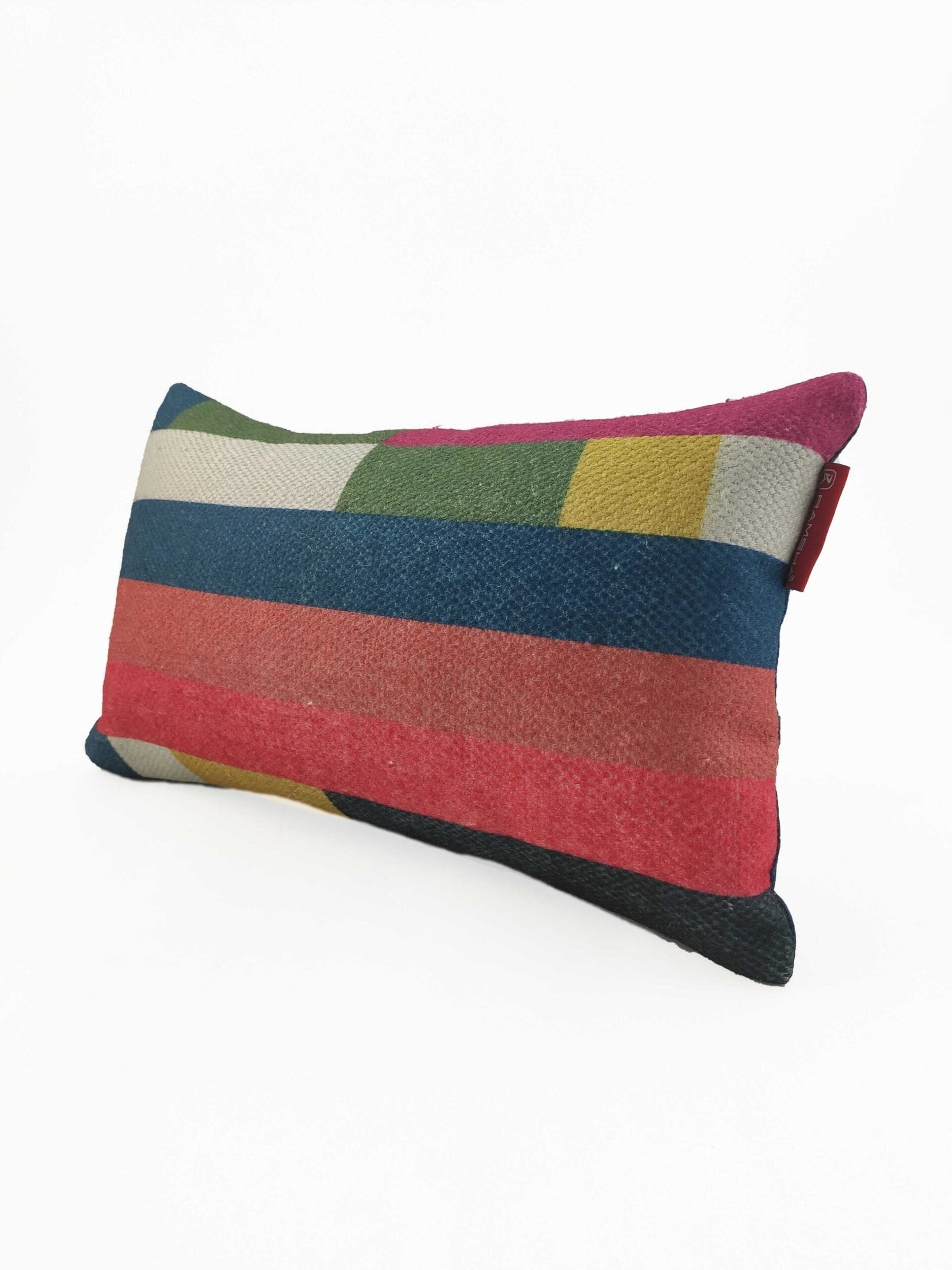 The RAMSHA HOME Decorative Cushion With Filler CS-071 features textured fabric with horizontal stripes in red, blue, green, yellow, cream, and black on white and a small red side tag. Perfect for adding style to your home.