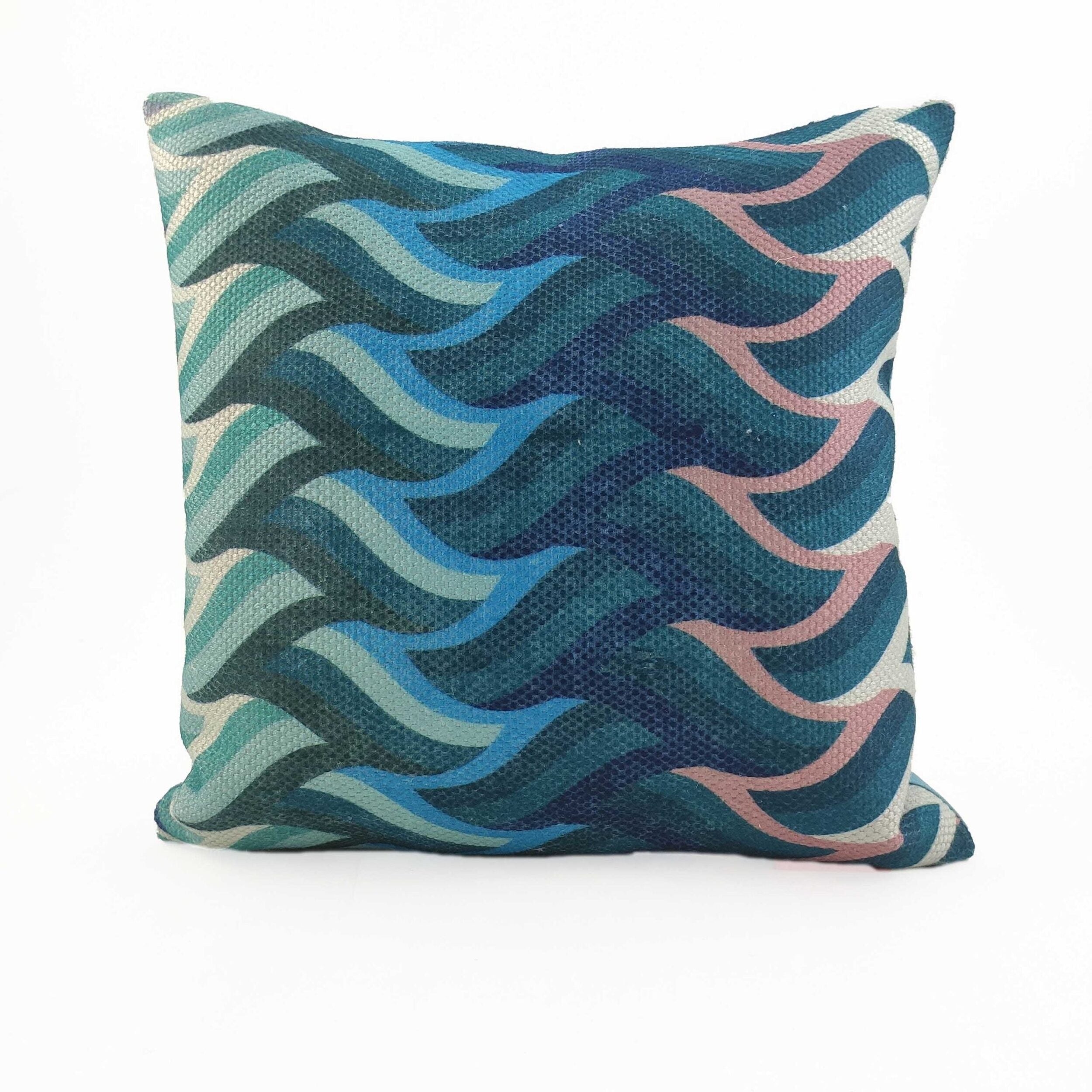 The RAMSHA HOME Cushion Cover Multi Color CS-069 features a wavy geometric blue, teal, and pink pattern on textured fabric with a durable polyester cover, shown against a plain white background.
