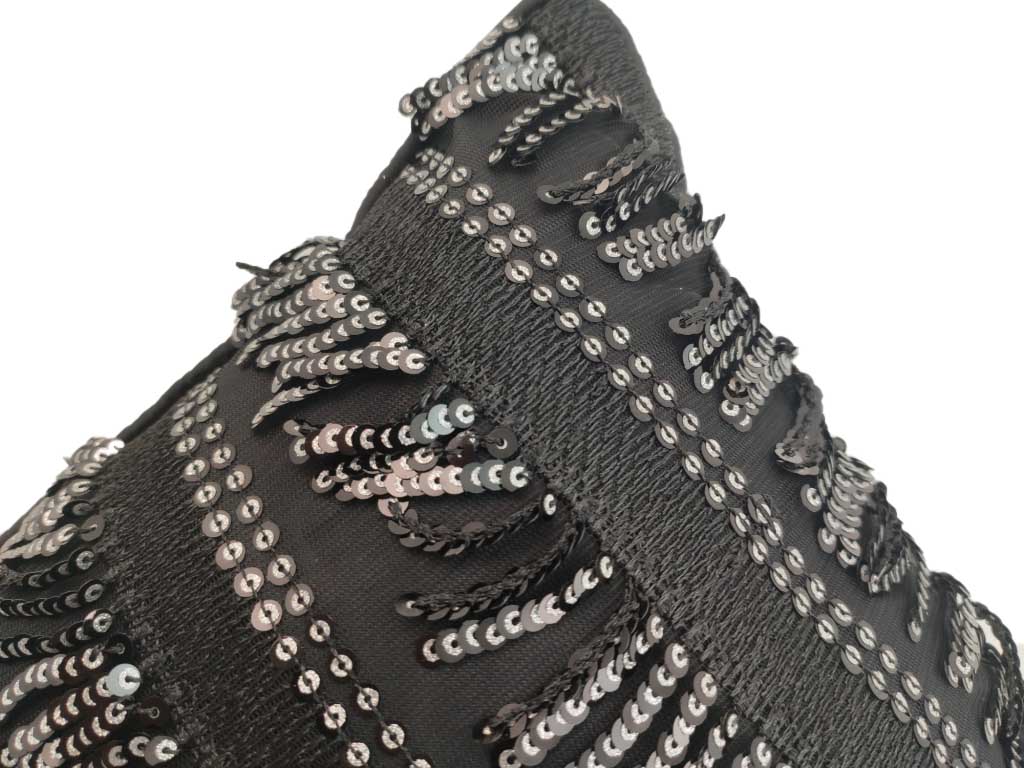 The RAMSHA HOME Polyester Sequence Cushion With Filler features decorative black fabric with rows of shiny silver polyester sequence in wavy patterns, creating an eye-catching and durable accent for your home.