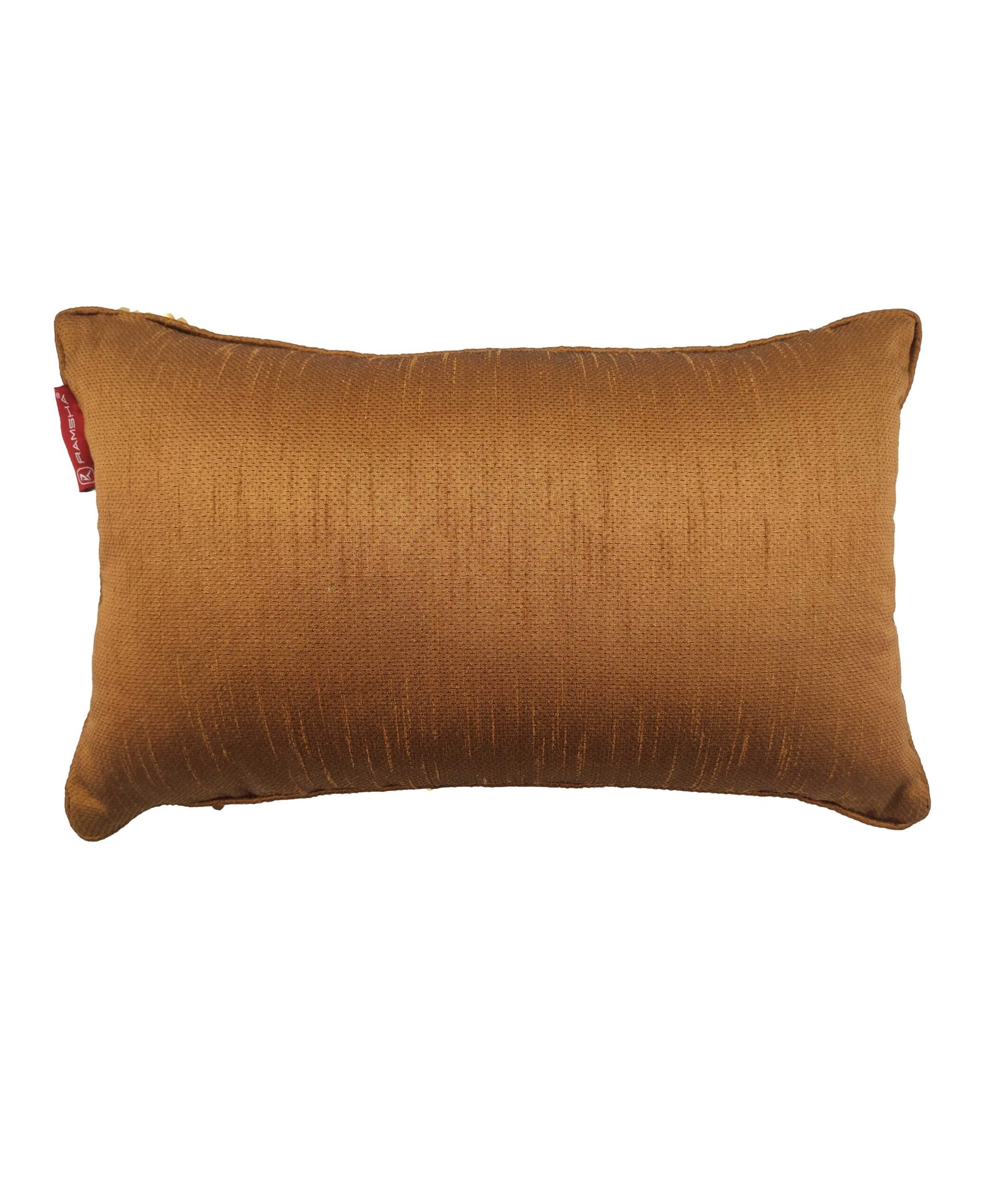 The Sequence Cushion With Filler by RAMSHA HOME is a rectangular brown cushion with a subtle textured pattern, superior comfort, and a small red tag on the left side, displayed against a white background.