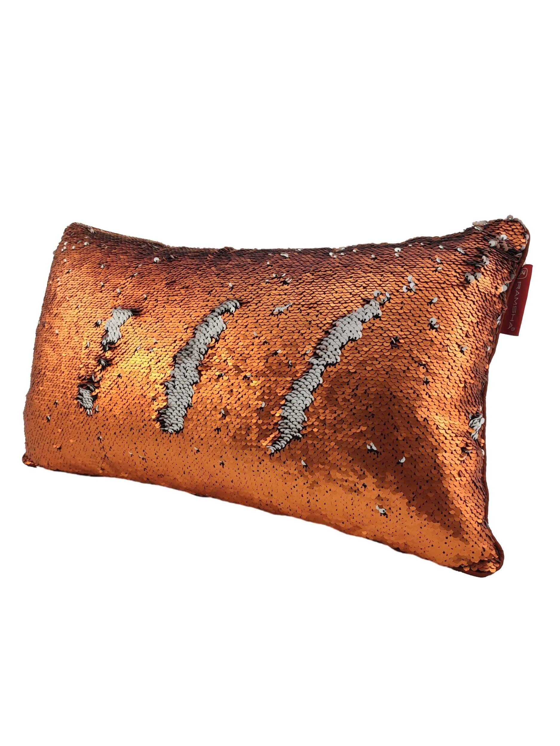 The RAMSHA HOME Polyester Double Color Changing Cushion With Filler features reversible sequins in copper and silver stripes, creating a dazzling, color-changing decorative accent for your space.