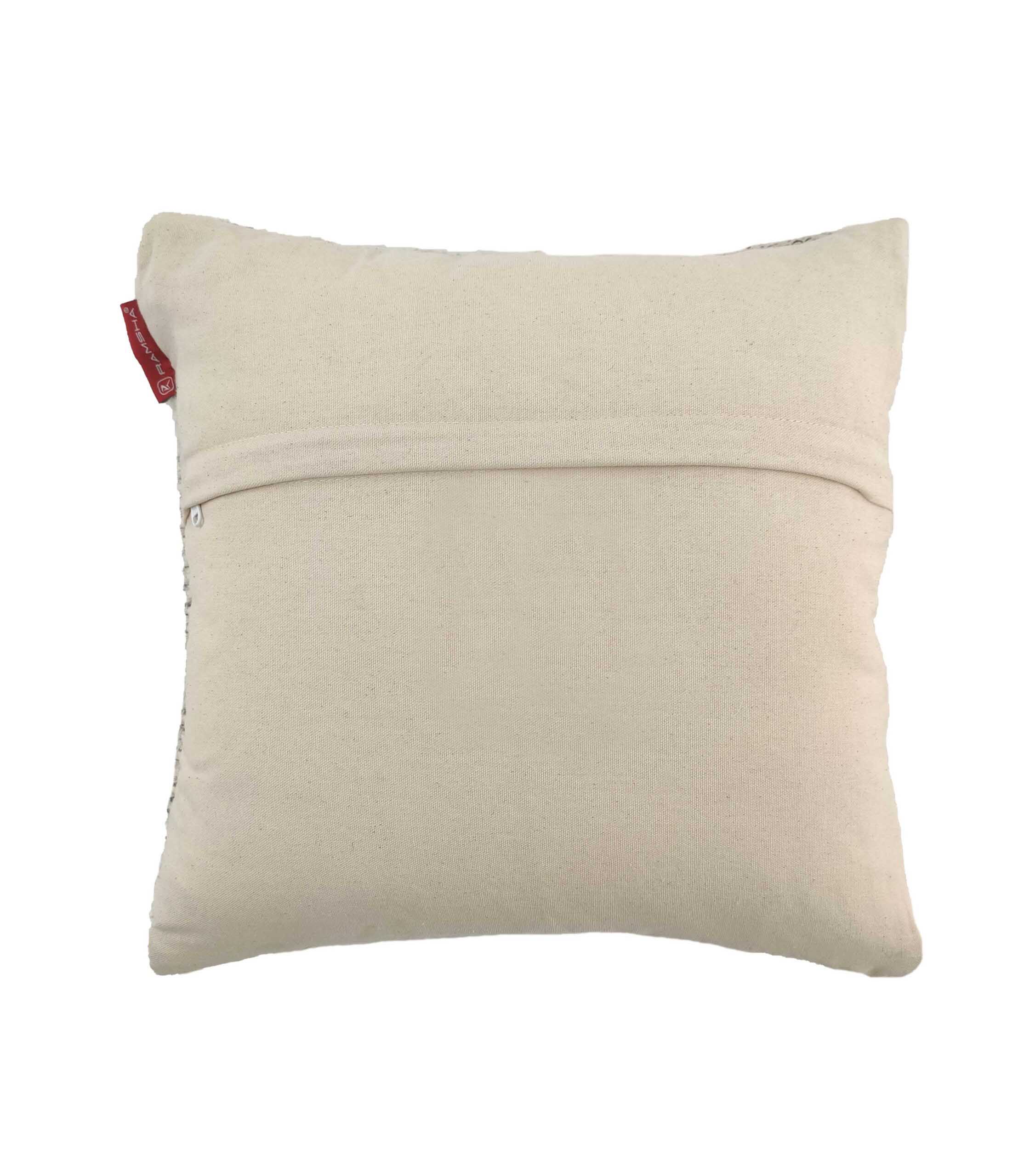 The RAMSHA HOME Wool & Cotton Cushion With Filler CS-046 is a plain, square beige cushion featuring a visible back zipper and a small red tag—perfect for adding cozy style to your home.
