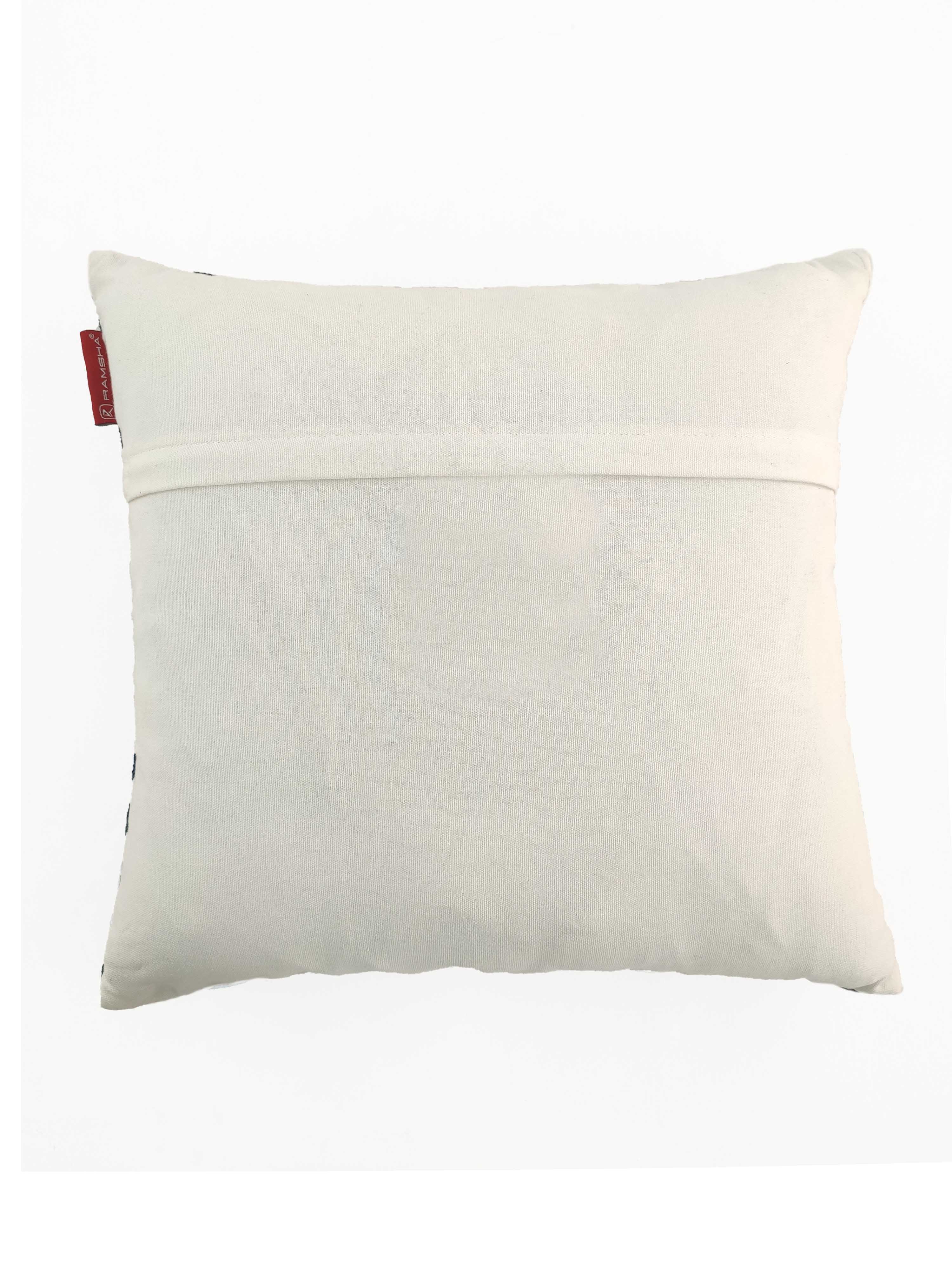 The RAMSHA HOME Cotton & Polyester Cushion CS-118 is a square, off-white cushion with a horizontal seam near the top and a small red tag on the left edge, shown on a plain white background.