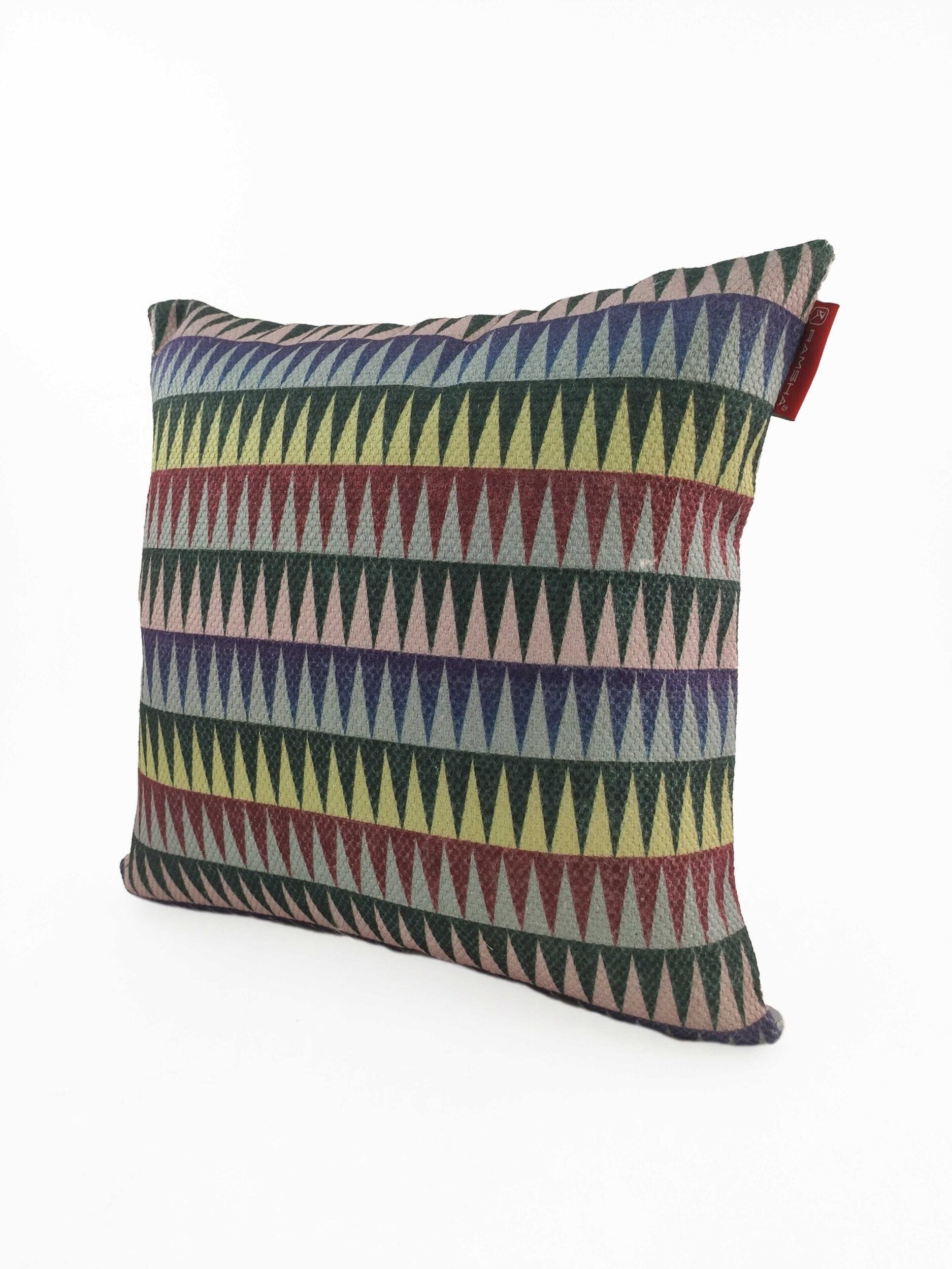 The RAMSHA HOME Polyester Cushion Cover CS-068 is a square, wrinkle-resistant cover with rows of multicolored triangles in geometric patterns, a red side tag, and is displayed on a plain white background.