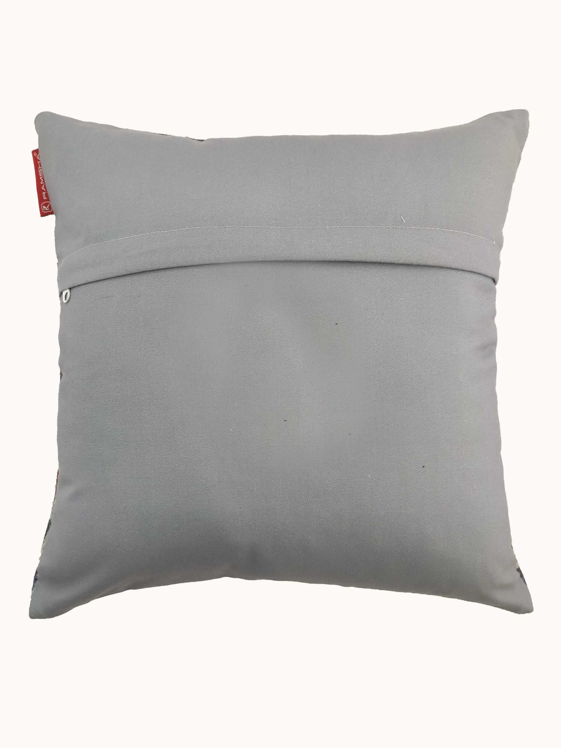 The RAMSHA HOME Polyester Cushion Cover CS-068 is a square, light grey, wrinkle-resistant cover with a back flap and button closure, featuring a small red side tag. Displayed on a plain white background.