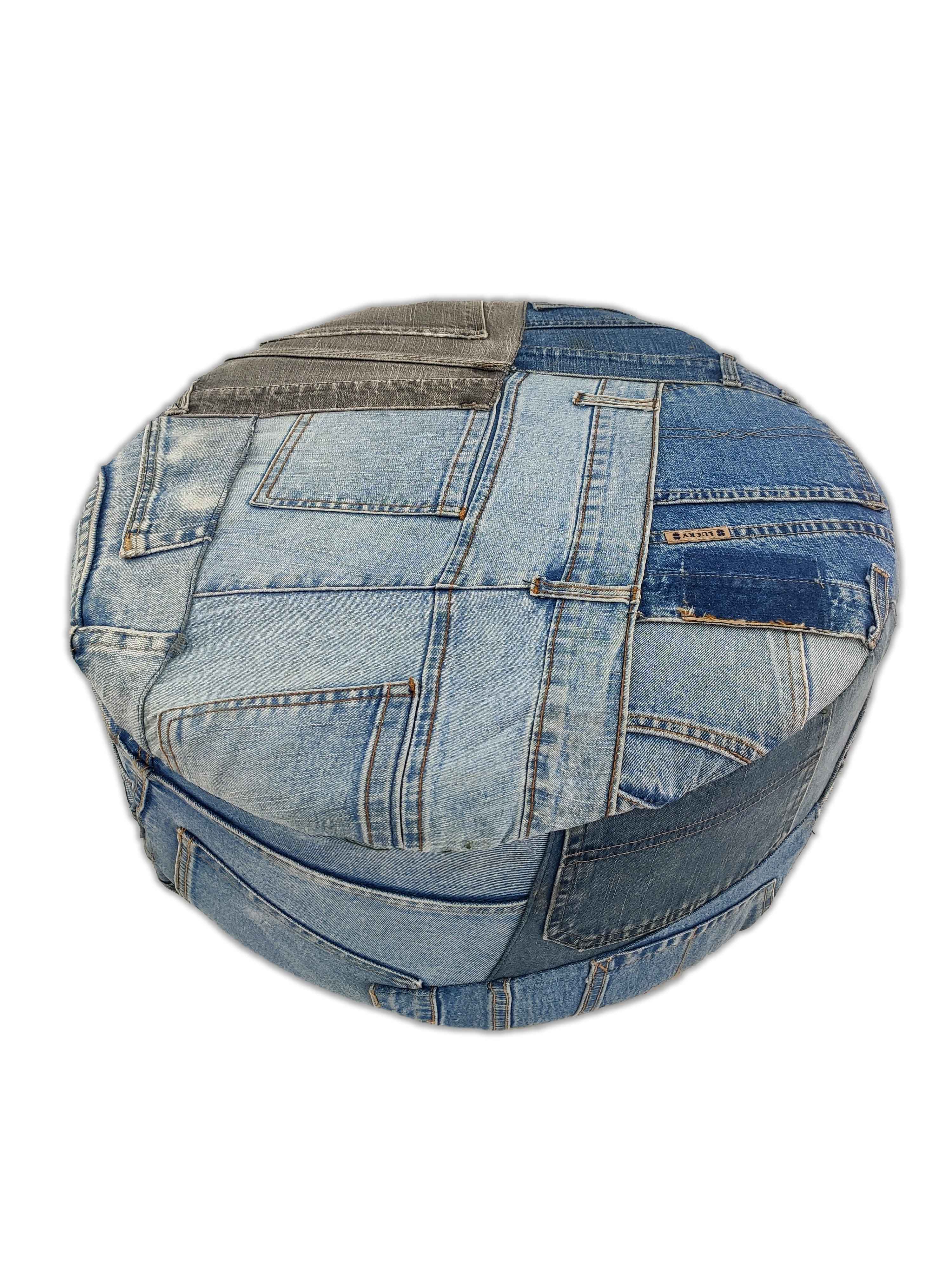 The RAMSHA HOME Denim Cotton Pouf PF-038 features a round shape and patchwork blue denim upholstery with visible pockets, seams, and stitching—making it a standout ottoman or pedestal-style accent for any space.