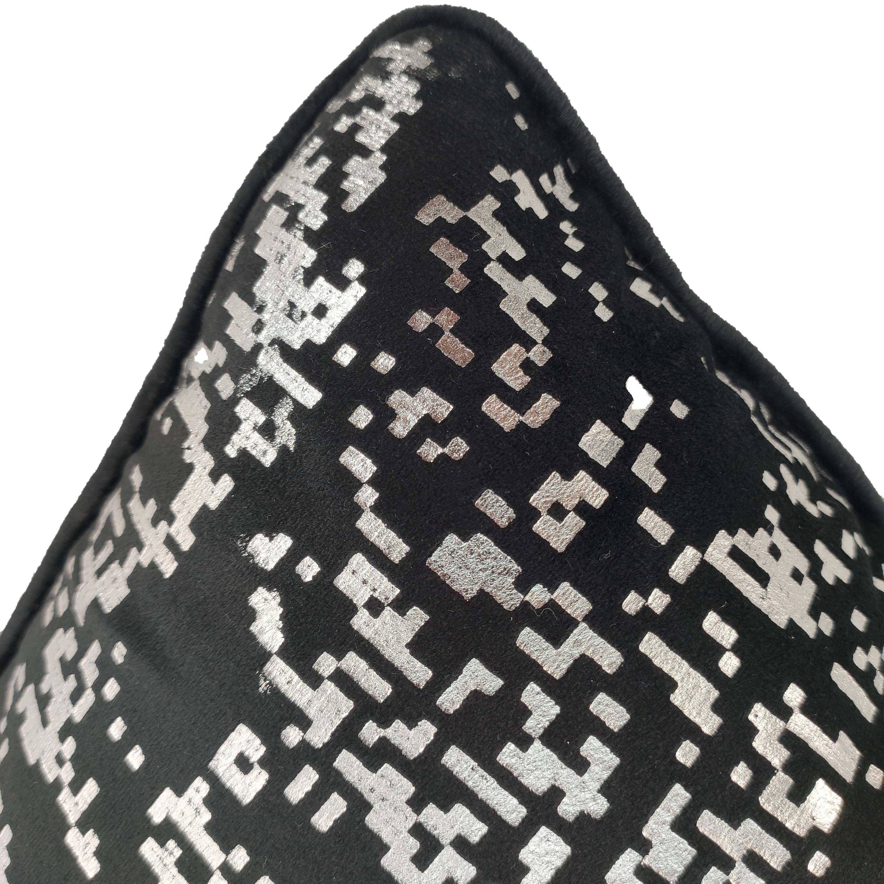 Close-up of RAMSHA HOME’s Polyester Black & Silver Cushion Cover CS-128, featuring a textured, pixelated geometric pattern—a modern accent for any home décor, shown here against a plain white background.