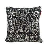 The RAMSHA HOME Polyester Black & Silver Cushion Cover CS-128 features a sleek black background with a silver pixelated design and a small red tag, adding a modern touch to your home décor.