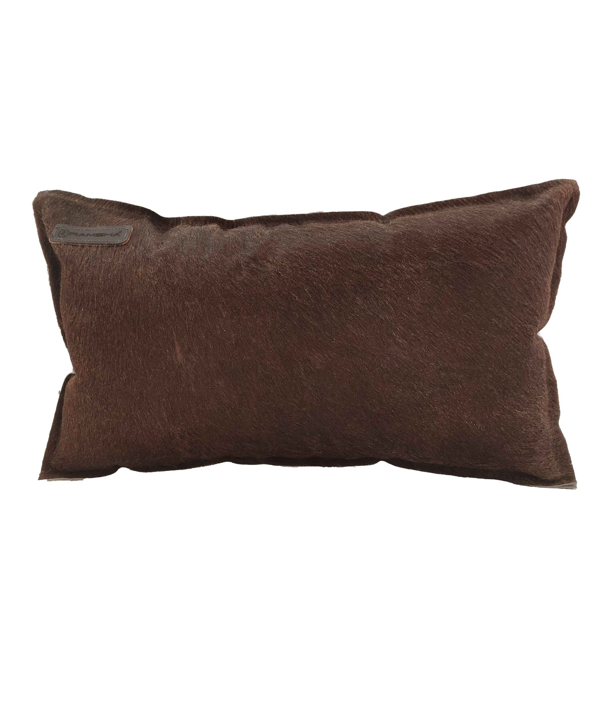 The RAMSHA HOME Leather Cushion With Filler CS-091 is a rectangular brown premium cushion featuring a soft, furry texture and a small fabric tag on one upper corner, displayed on a plain white background.