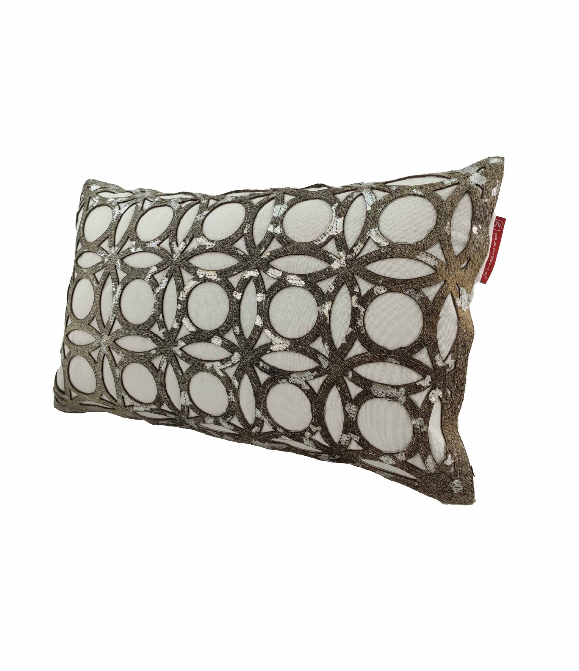 The RAMSHA HOME Leather Cushion CS-100 is a rectangular white cushion with a geometric pattern of interlocking circles and lines in metallic/gray tones, a red fabric side tag, and durable high-quality filling for lasting comfort.