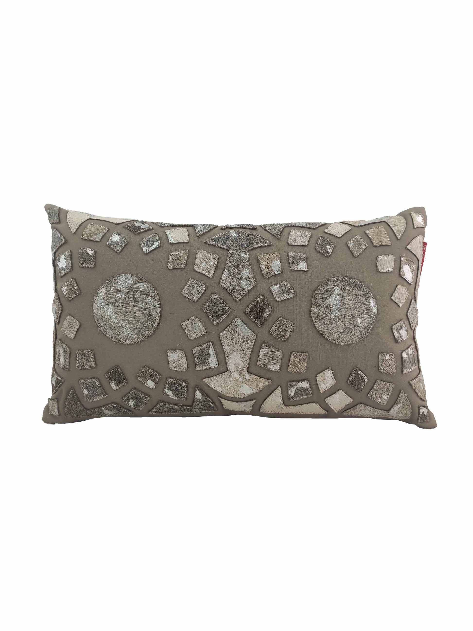 The RAMSHA HOME Decorative Cushion CS-105 features a taupe base with a mosaic of metallic and neutral patches, two bold circular accents, and is crafted from high-quality polyester and leather for an elegant decorative touch.