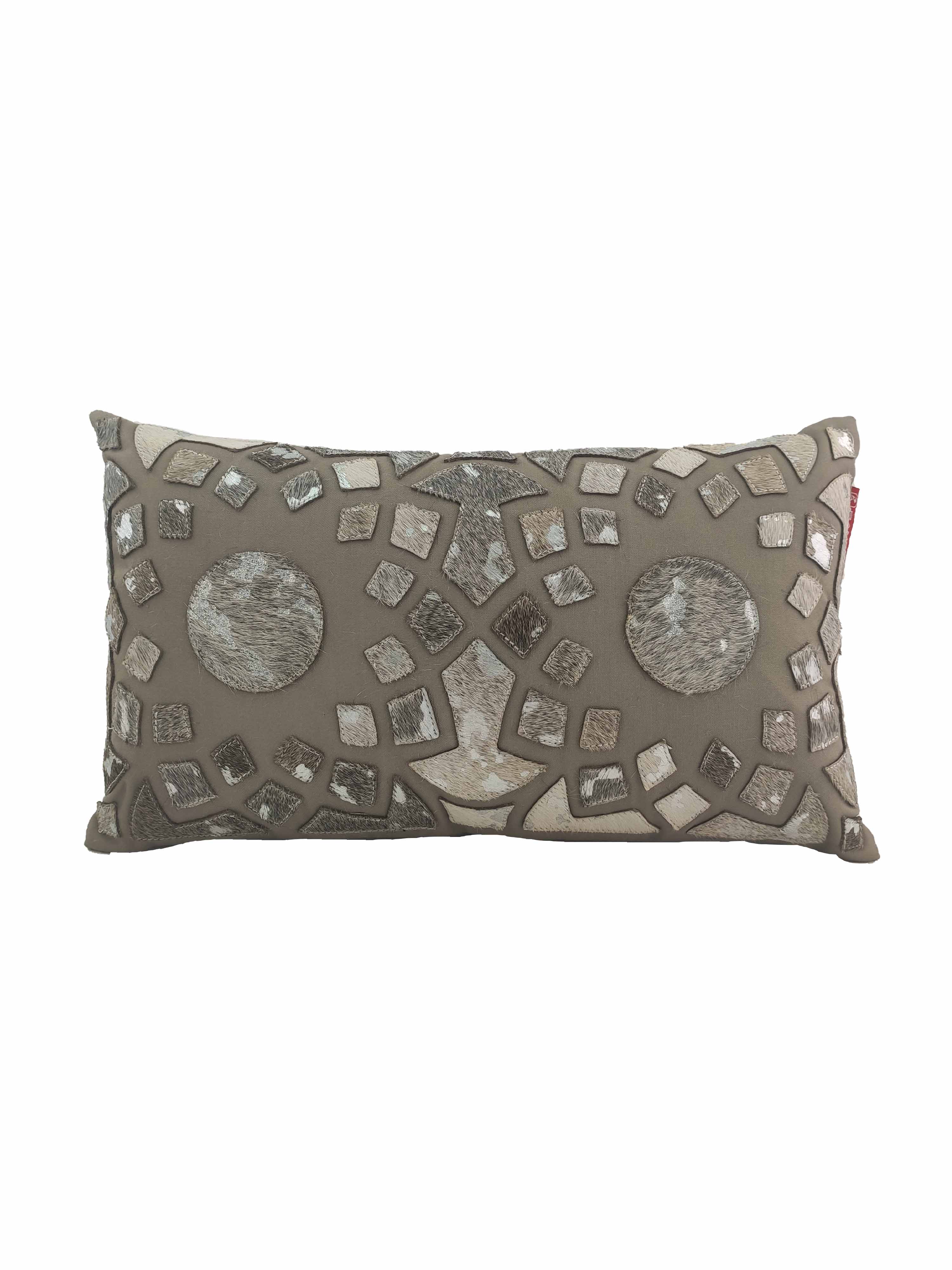 The RAMSHA HOME Decorative Cushion CS-105 features a taupe base with a mosaic of metallic and neutral patches, two bold circular accents, and is crafted from high-quality polyester and leather for an elegant decorative touch.