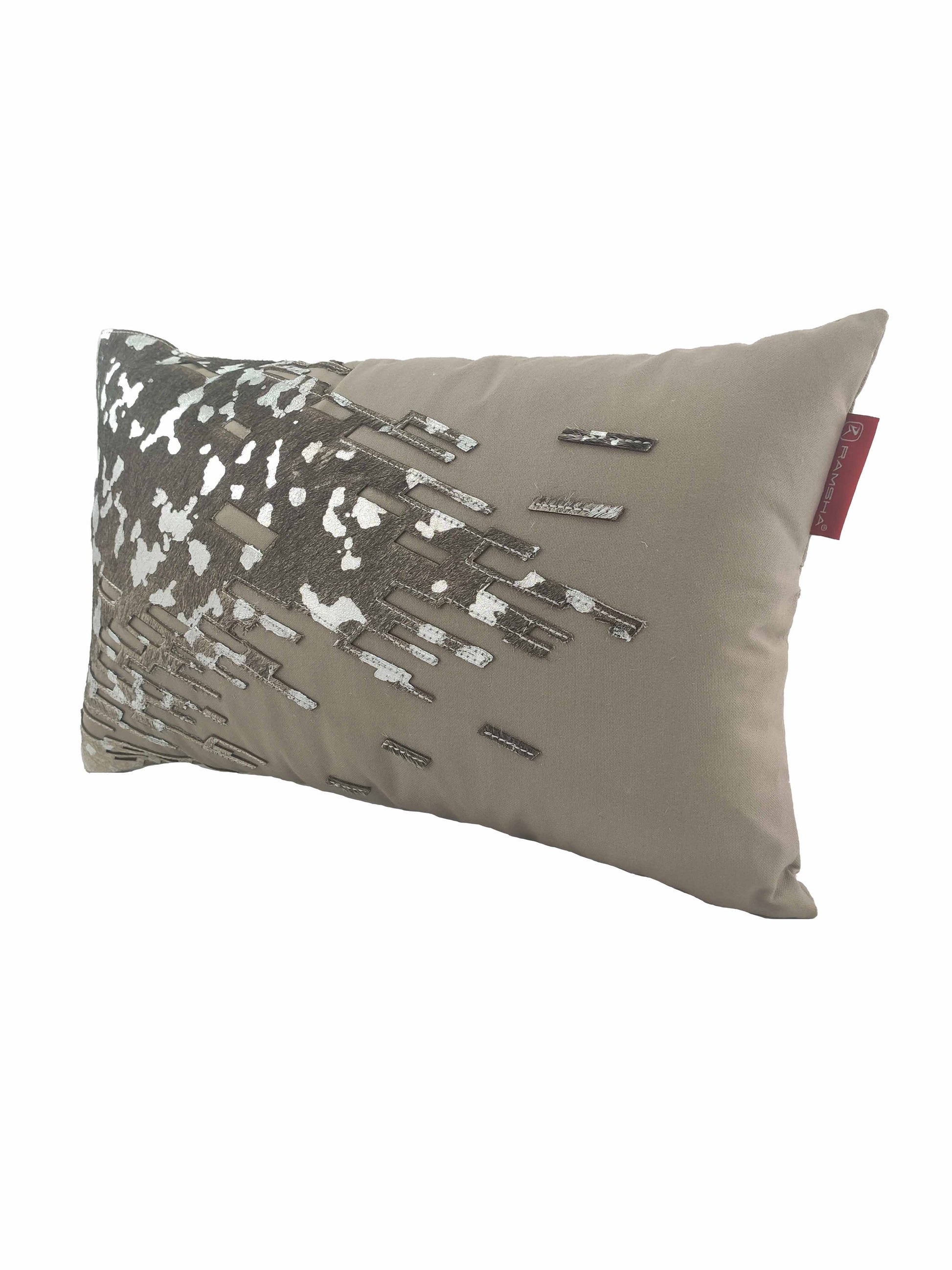 The RAMSHA HOME CS-108 Leather Decor Cushion features a stylish rectangular taupe satin design with abstract silver and dark brown embroidery, a red edge tag, and adds sophistication to your space.