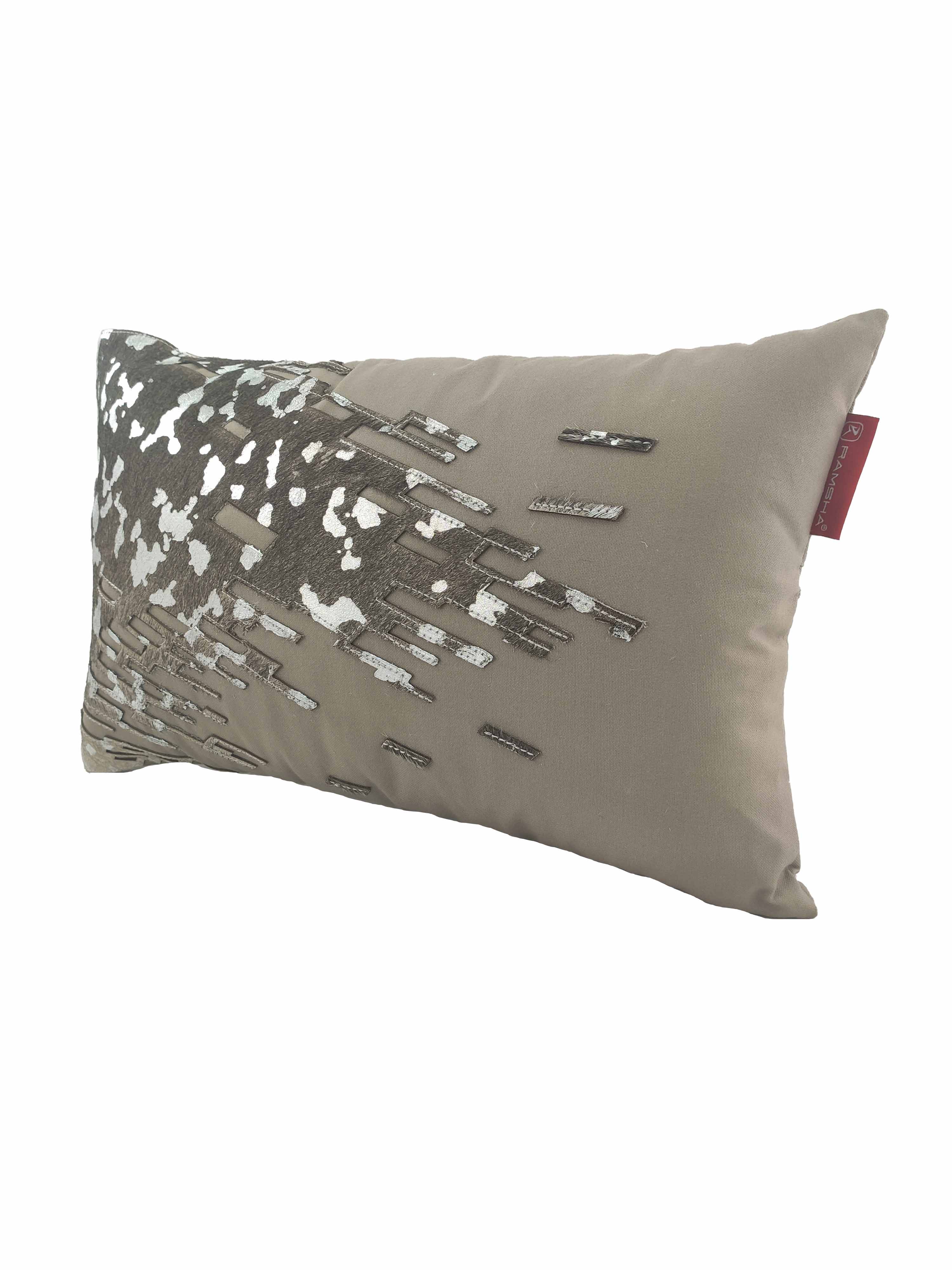 The RAMSHA HOME CS-108 Leather Decor Cushion features a stylish rectangular taupe satin design with abstract silver and dark brown embroidery, a red edge tag, and adds sophistication to your space.
