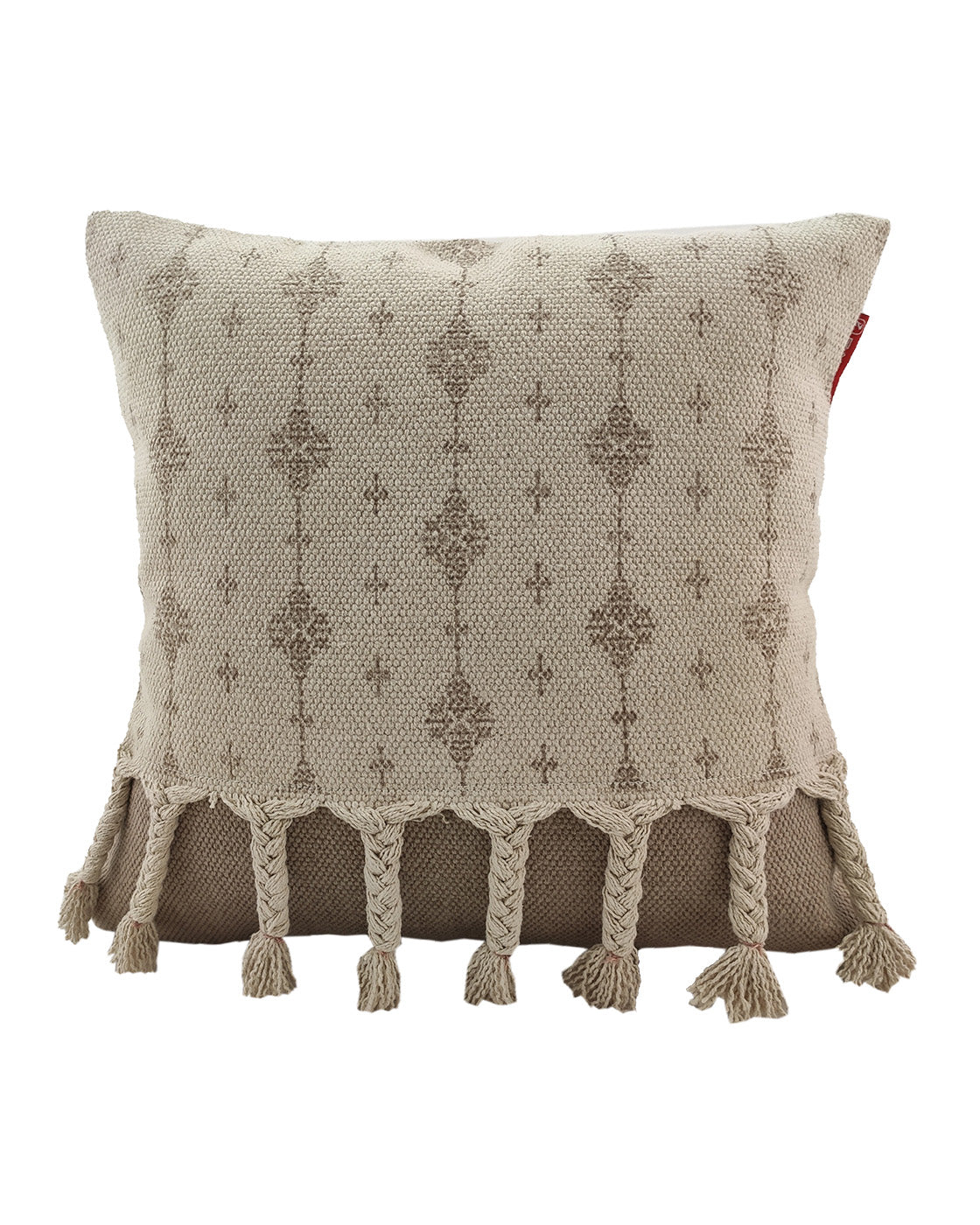 The RAMSHA HOME Printed Cotton Cushion With Fringes cs-172 is a beige decorative pillow with textured knit design, braided tassels along the bottom edge, and a small red brand tag on the right side.