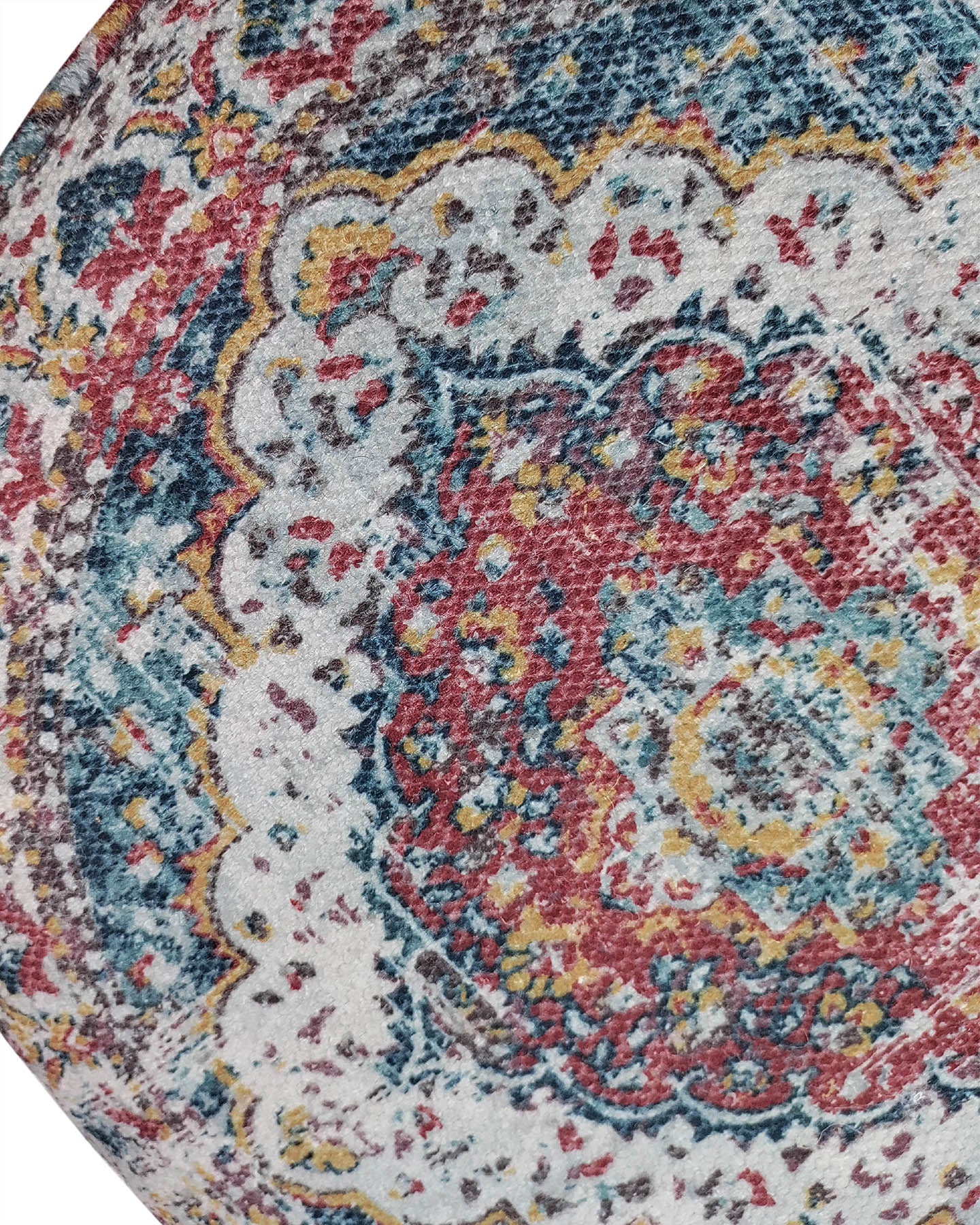 A close-up shows a colorful, patterned area rug with the RAMSHA HOME Multi Color Pouf With Leather Handle PF-078. Intricate circular designs in red, blue, yellow, and ivory feature detailed textures and ornate motifs for added style.