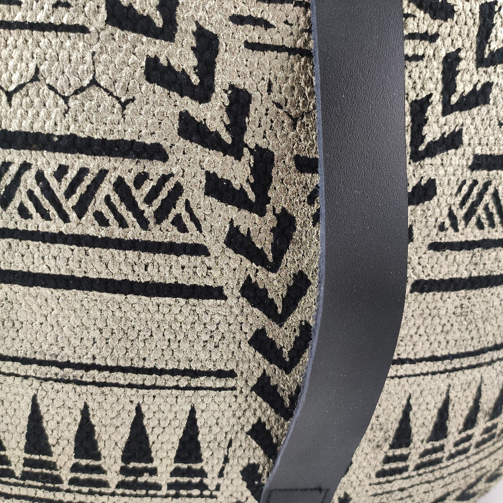 Detailed close-up of black and gold cotton pouf PF-092 showing intricate woven texture and fine craftsmanship.