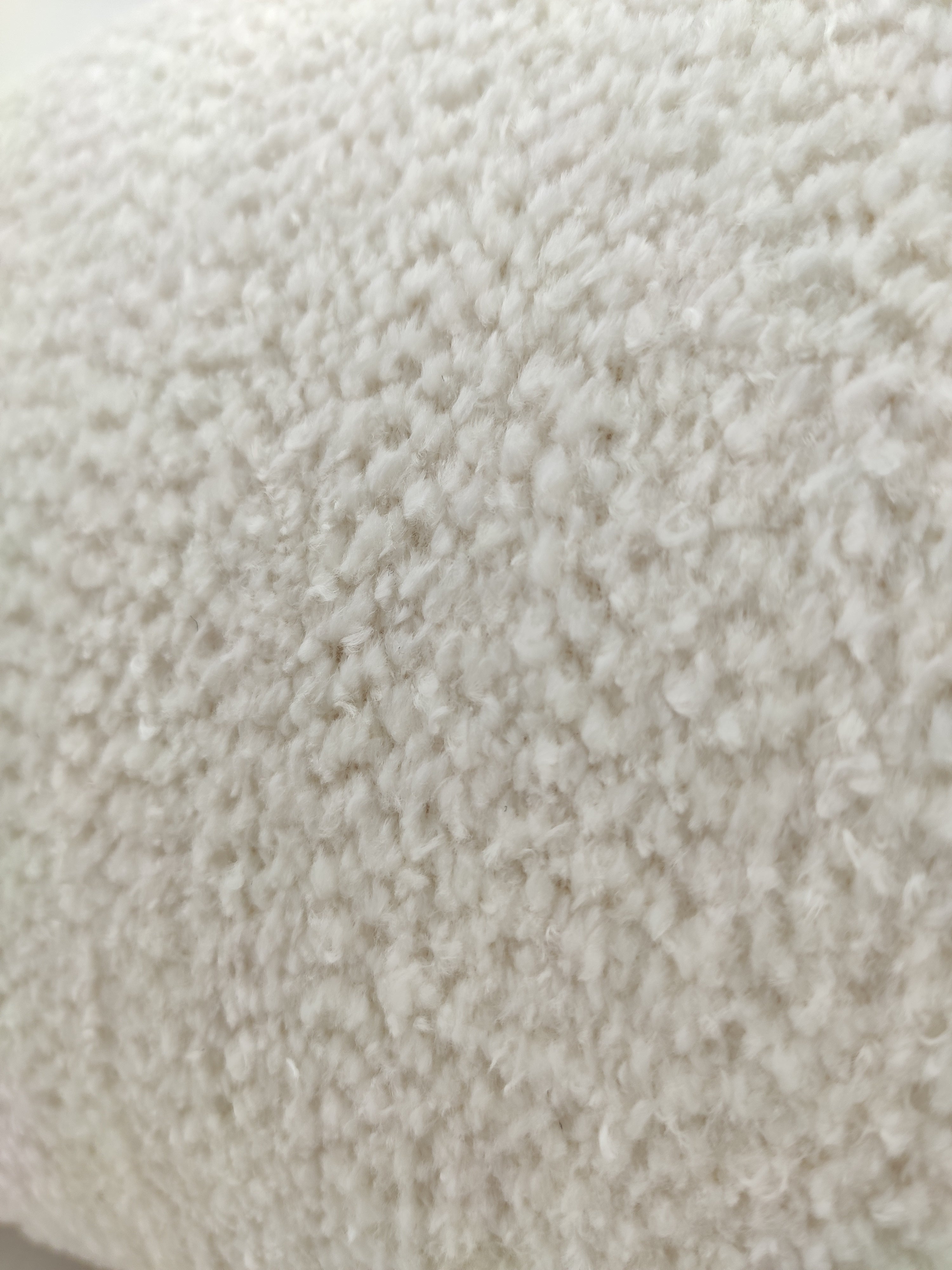 Close-up of RAMSHA HOME's Boho Cushion With Small Furr, featuring soft, textured white fabric with a fuzzy surface and small loops—ideal for cozy comfort with plush poly fill cotton.