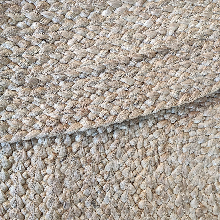 Close-up of the RAMSHA HOME Beautiful Natural Color with Black Line Braided Outdoor Rug 200 CM- BR 055, highlighting its detailed woven patterns and beige, light brown, and black tones.